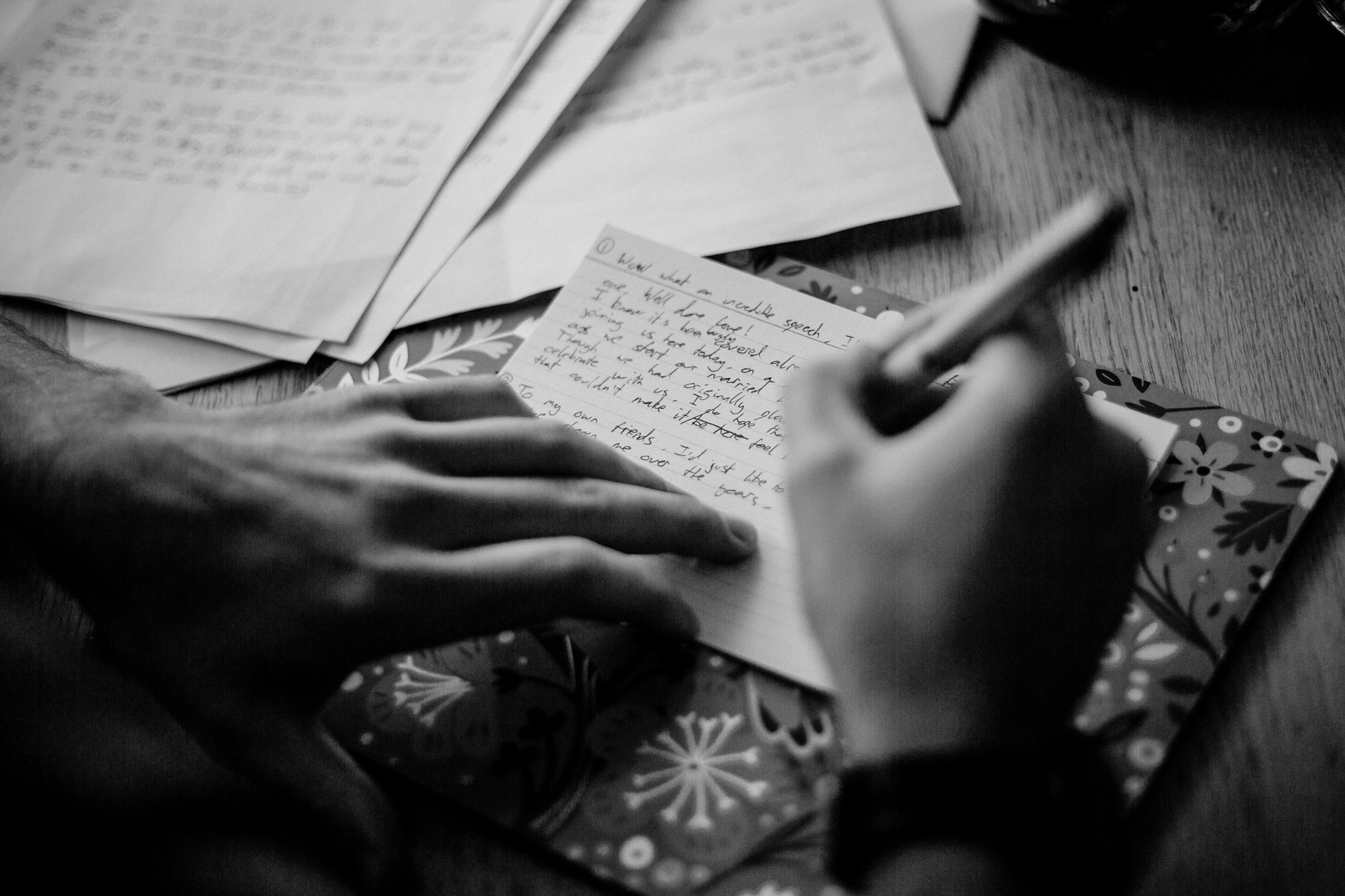 A person writing on a piece of paper