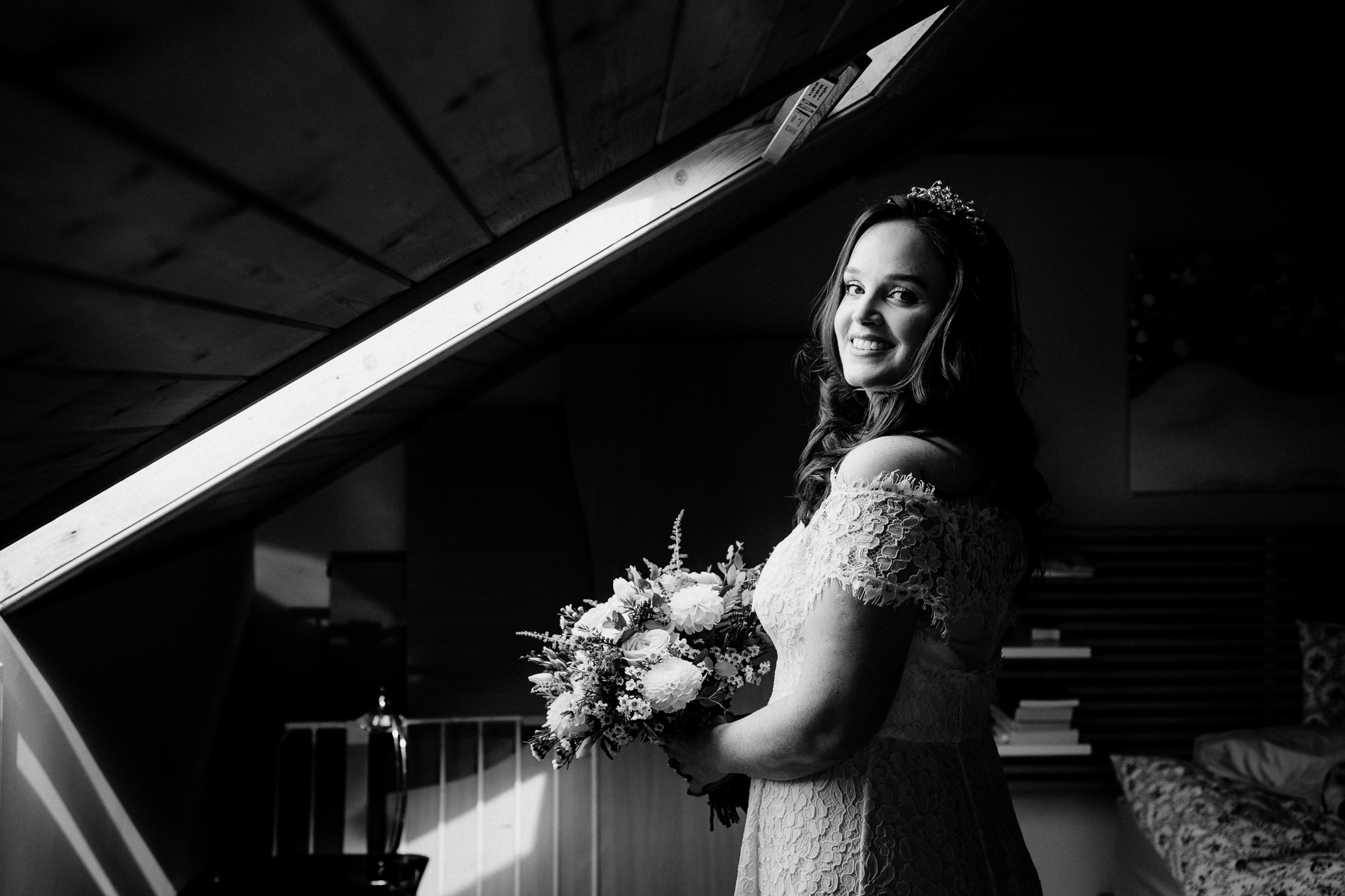 A woman in a dress holding flowers