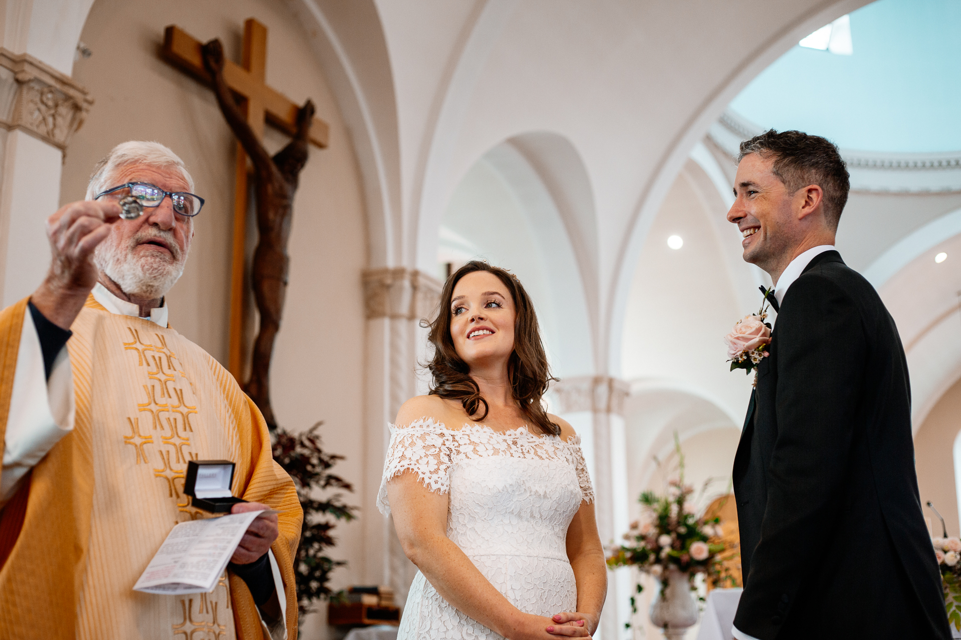 A bride and groom walking down the aisle