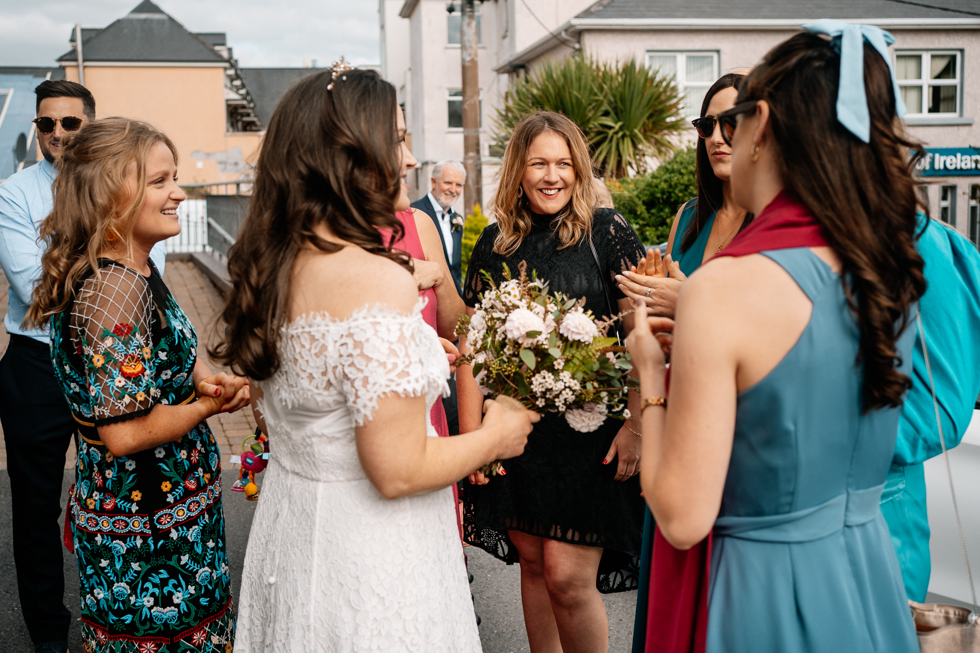 A group of women walking down a street