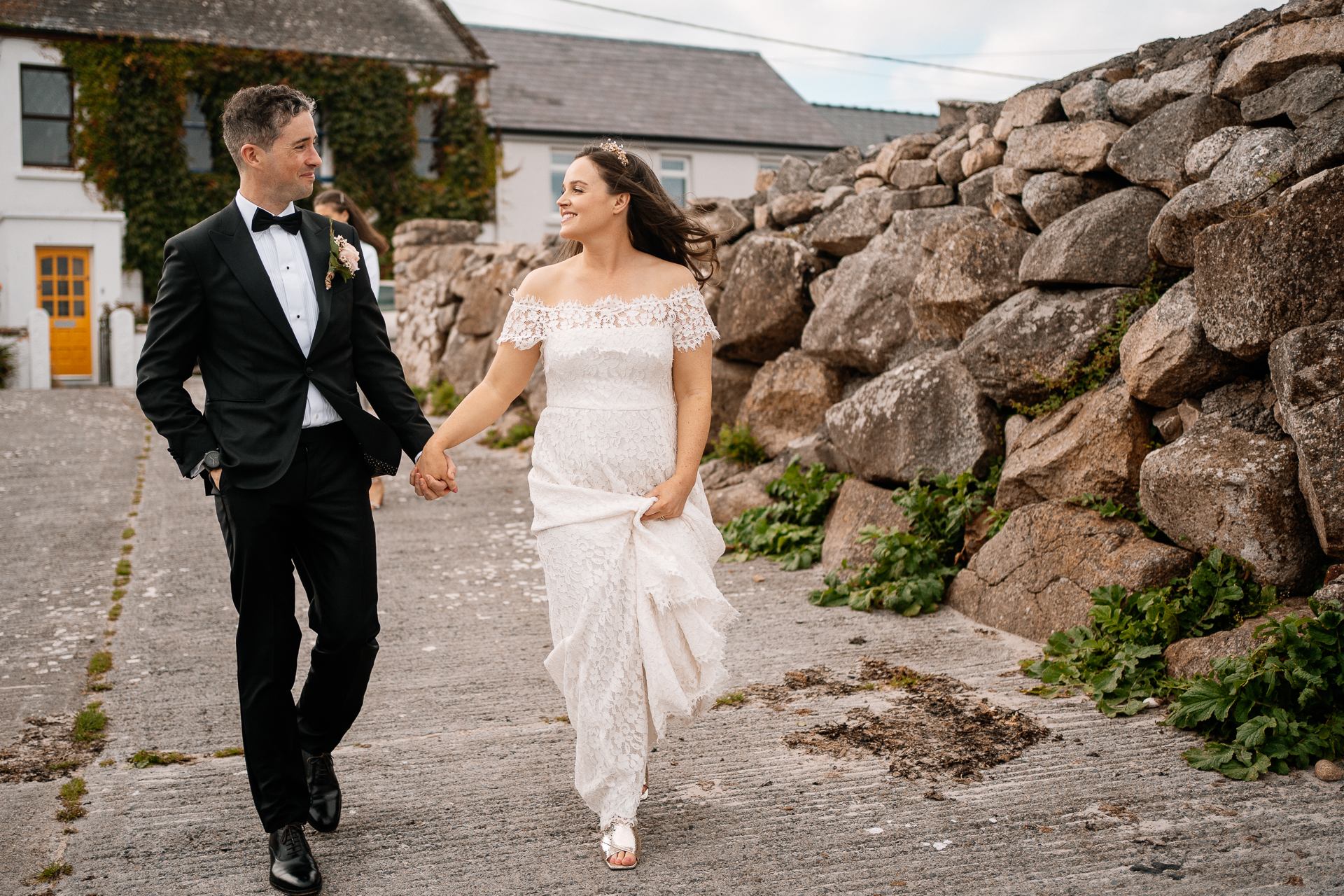 A man and woman walking down a street