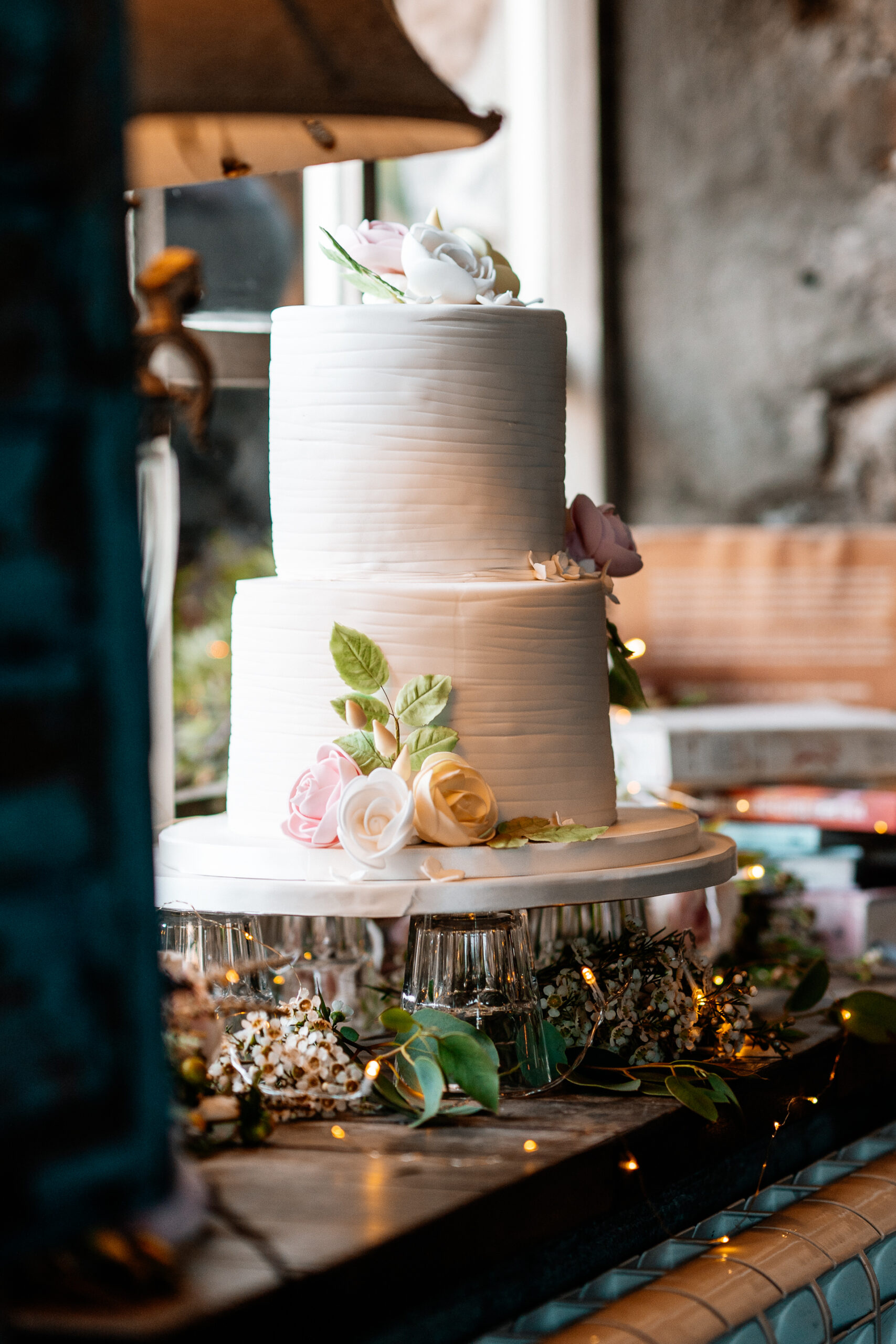 A white cake with flowers on a table