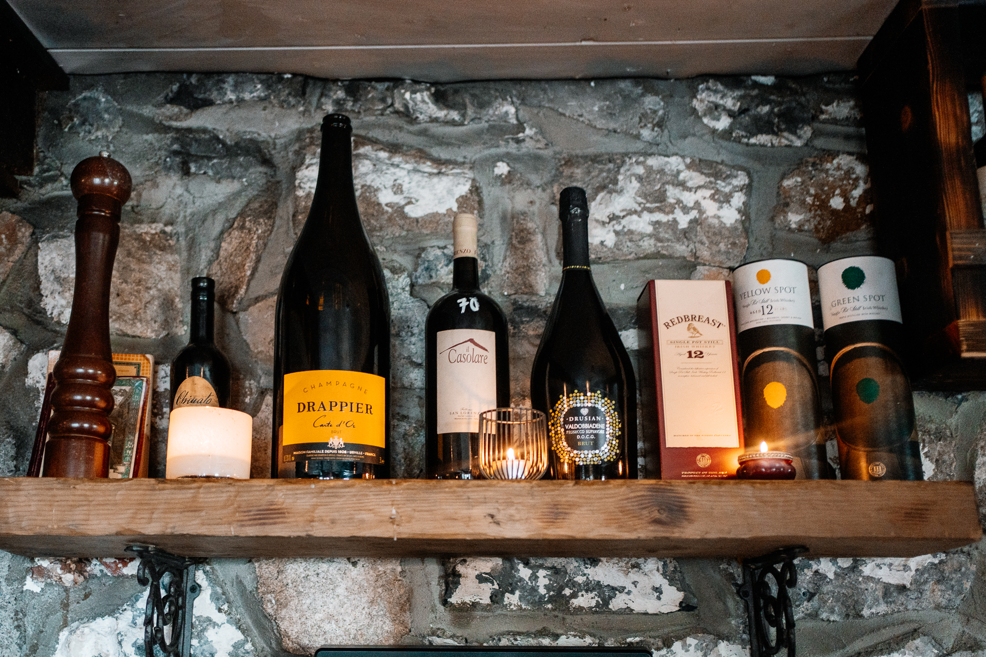 A group of bottles on a shelf