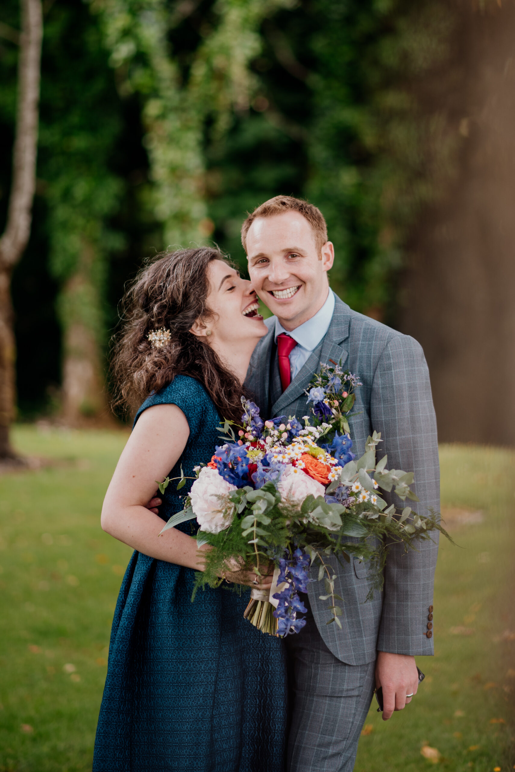 Bride and groom sharing an intimate moment during their outdoor wedding photoshoot at Glenlo Abbey Hotel, Galway.