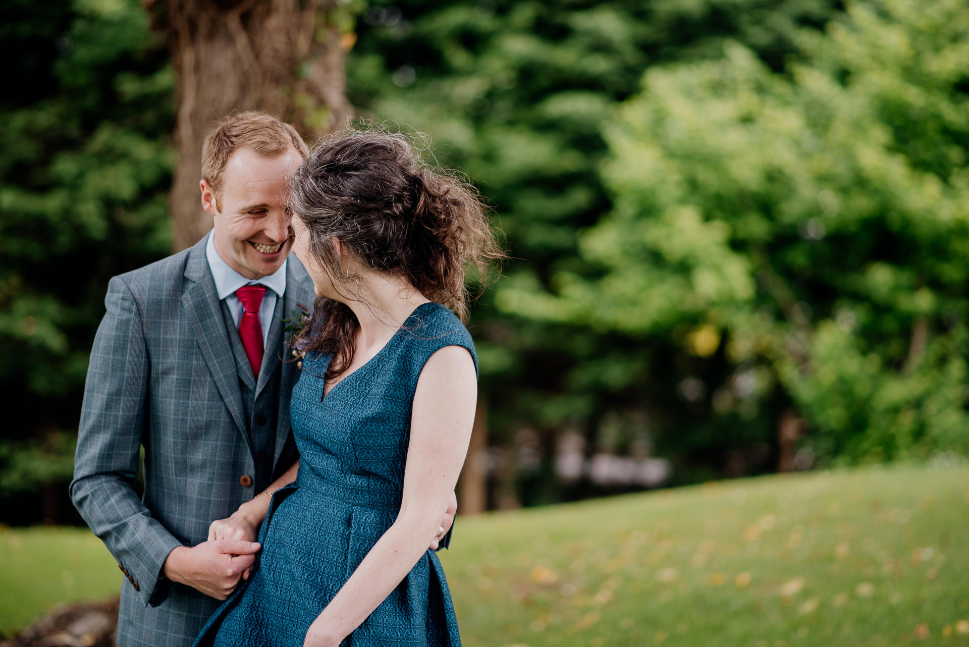 Bride and groom sharing an intimate moment during their outdoor wedding photoshoot at Glenlo Abbey Hotel, Galway.