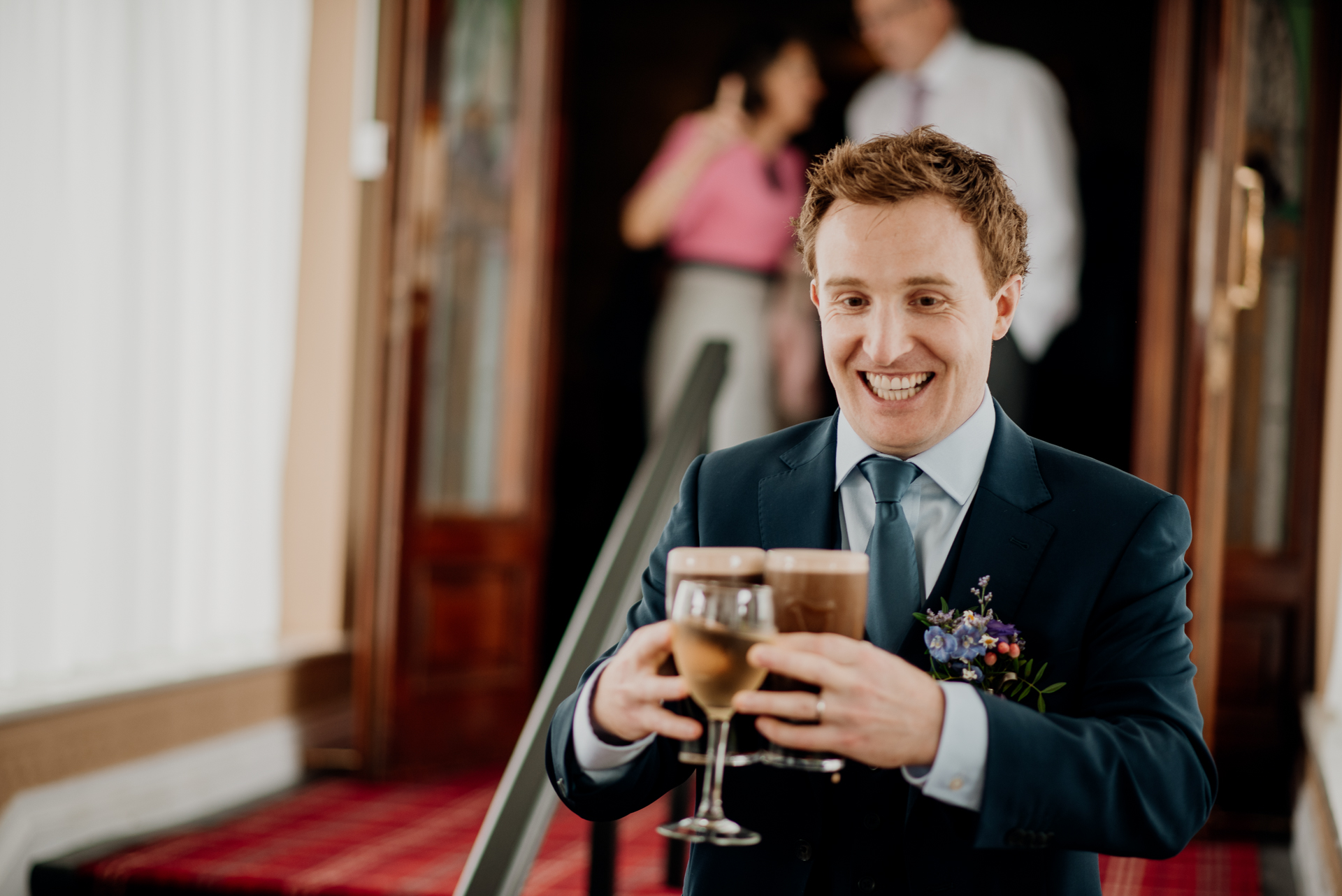 Bride and groom enjoying their wedding reception at Glenlo Abbey Hotel, surrounded by family and friends.