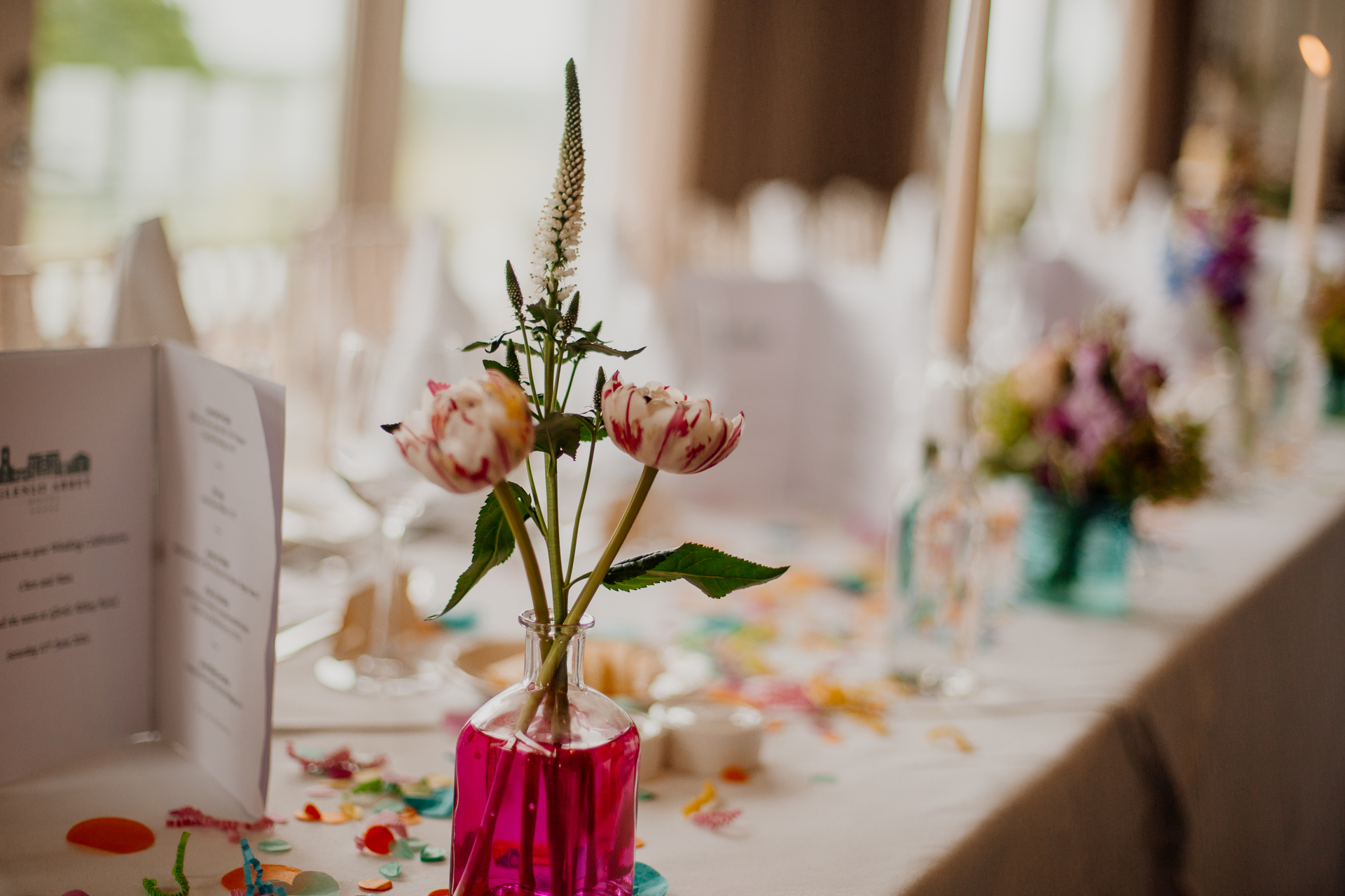 Bride and groom enjoying their wedding reception at Glenlo Abbey Hotel, surrounded by family and friends.