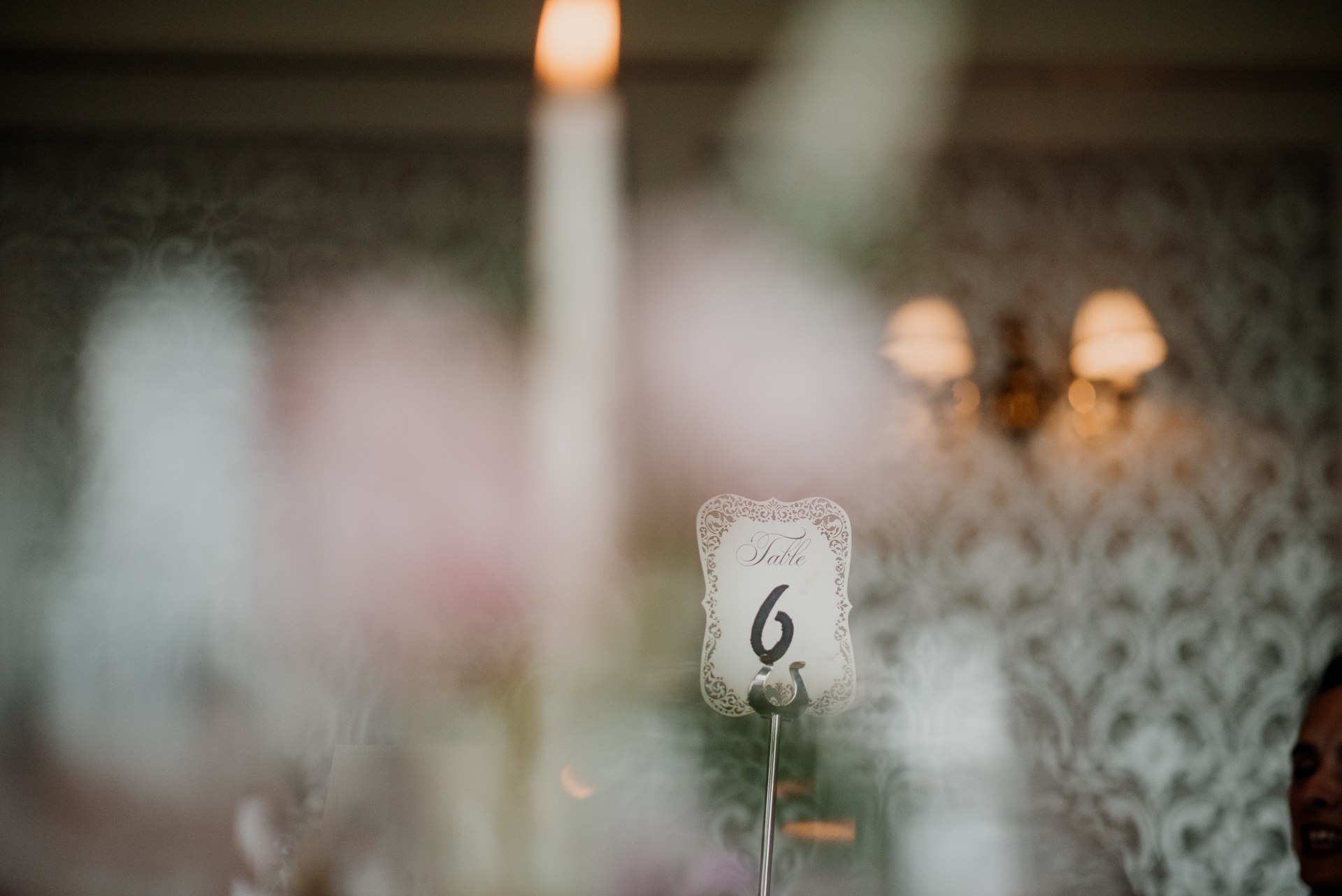 Bride and groom enjoying their wedding reception at Glenlo Abbey Hotel, surrounded by family and friends.