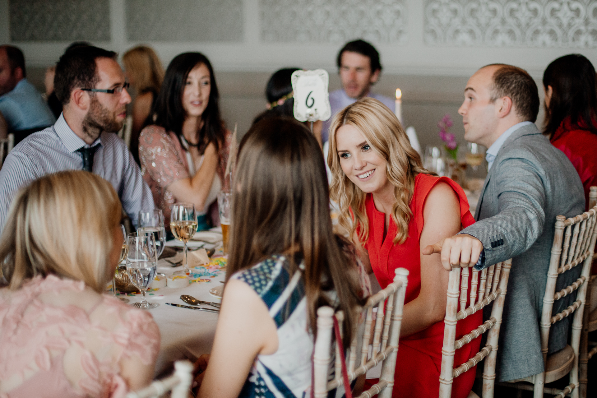 Bride and groom enjoying their wedding reception at Glenlo Abbey Hotel, surrounded by family and friends.