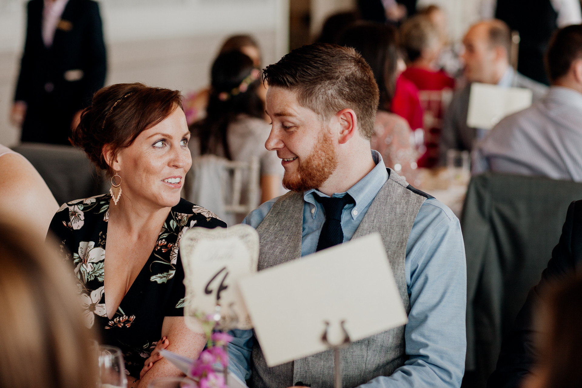 Bride and groom enjoying their wedding reception at Glenlo Abbey Hotel, surrounded by family and friends.