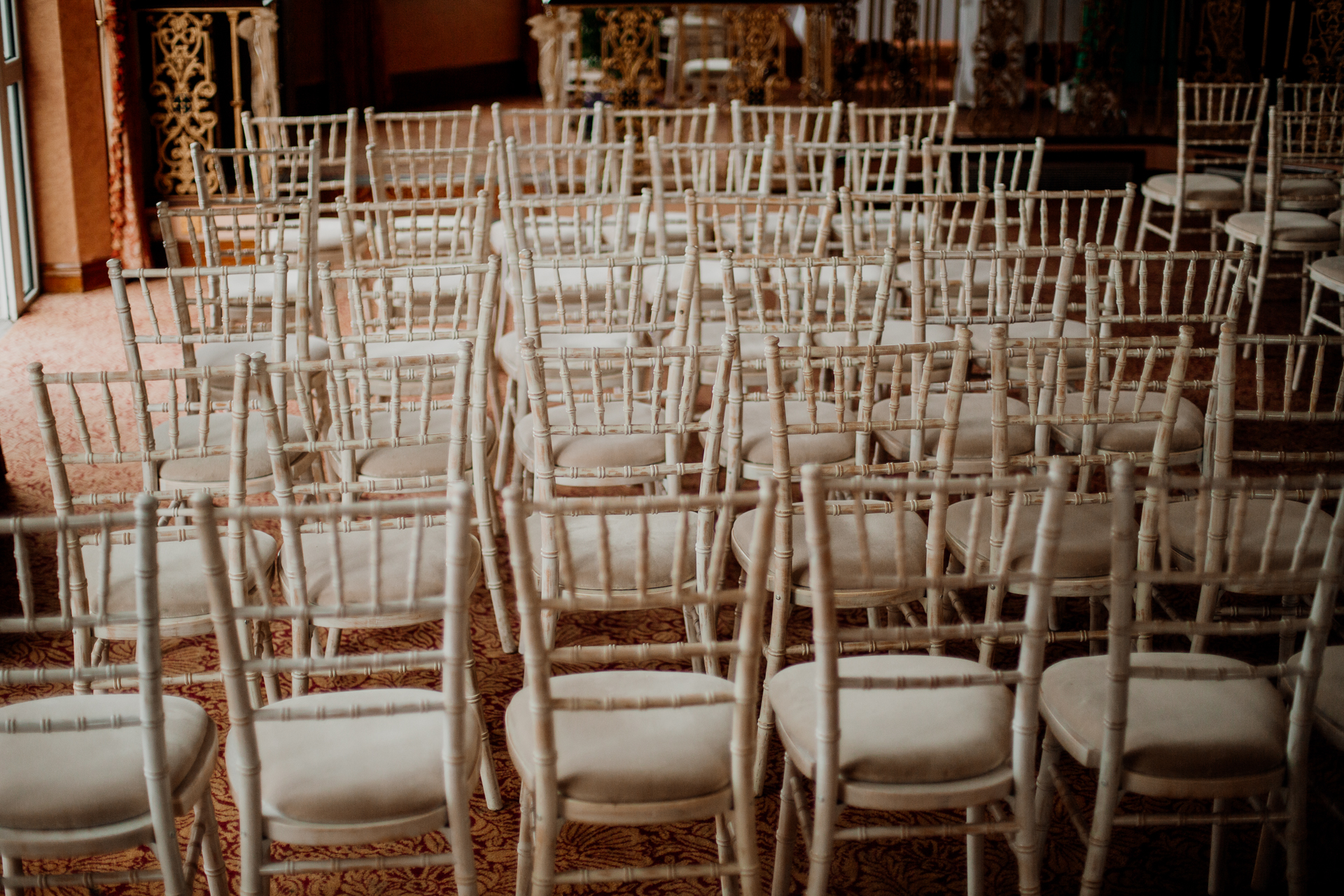 Bride and groom exchanging vows during their wedding ceremony at Glenlo Abbey Hotel, Galway.