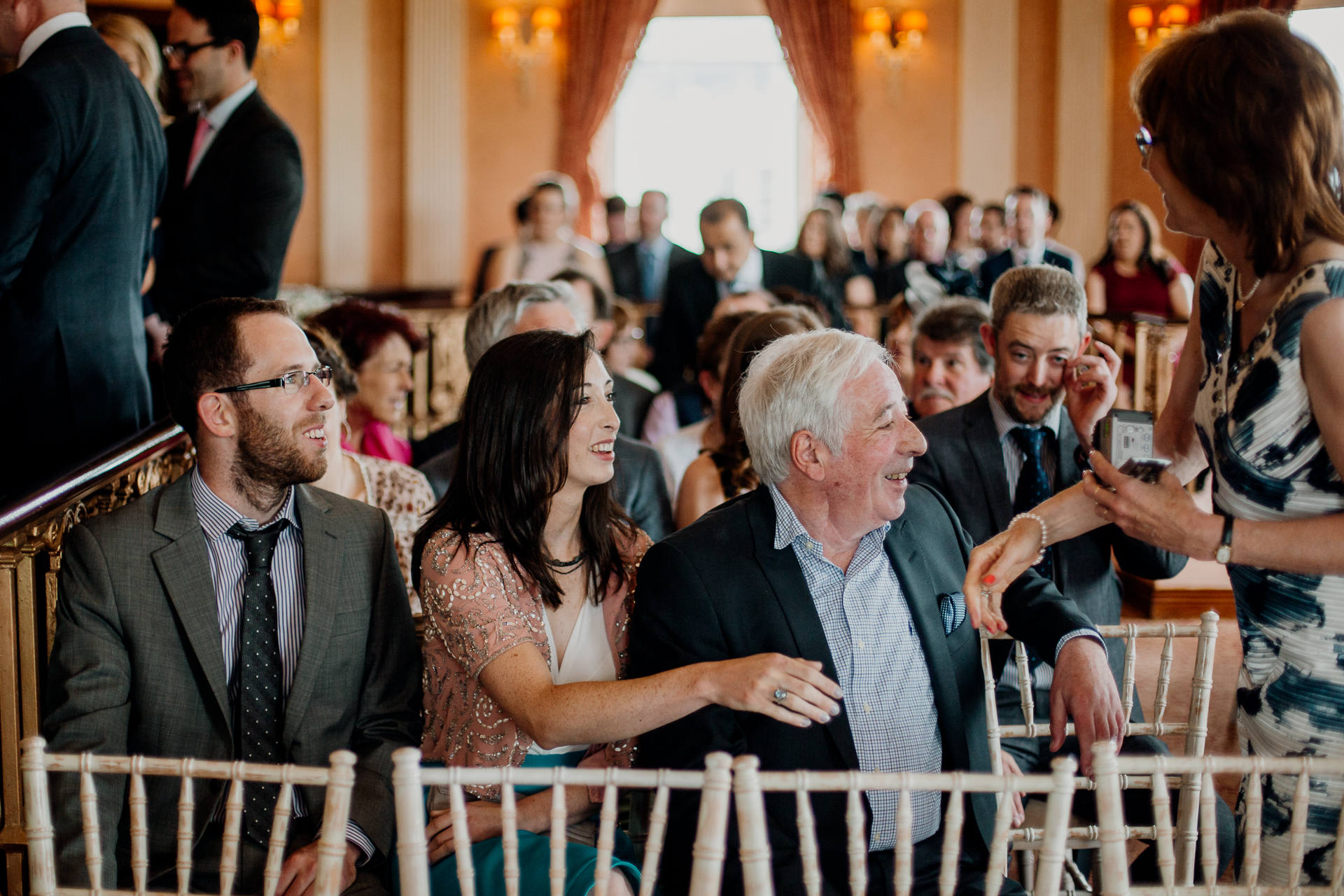 Bride and groom exchanging vows during their wedding ceremony at Glenlo Abbey Hotel, Galway.