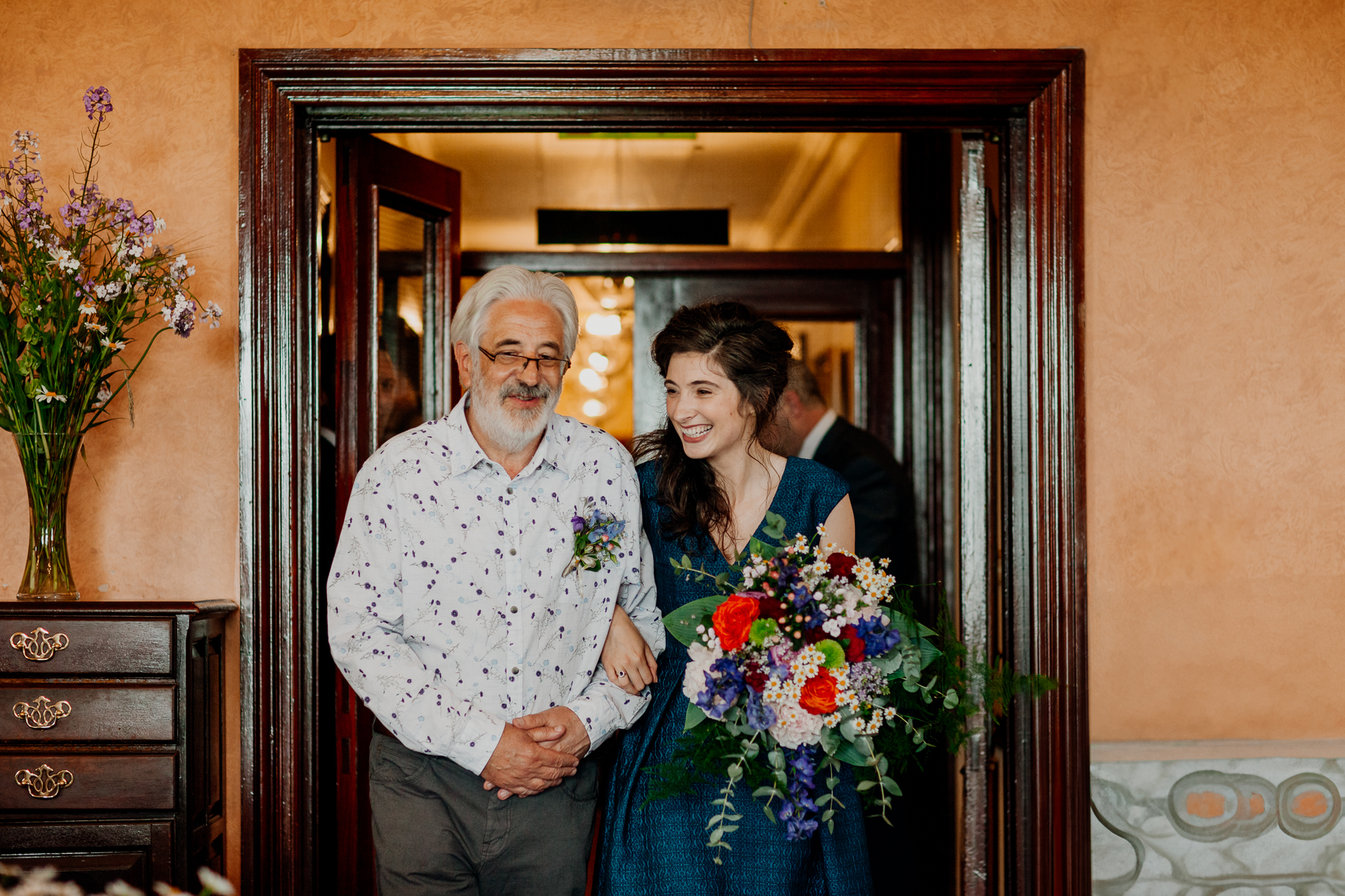 Bride and groom exchanging vows during their wedding ceremony at Glenlo Abbey Hotel, Galway.