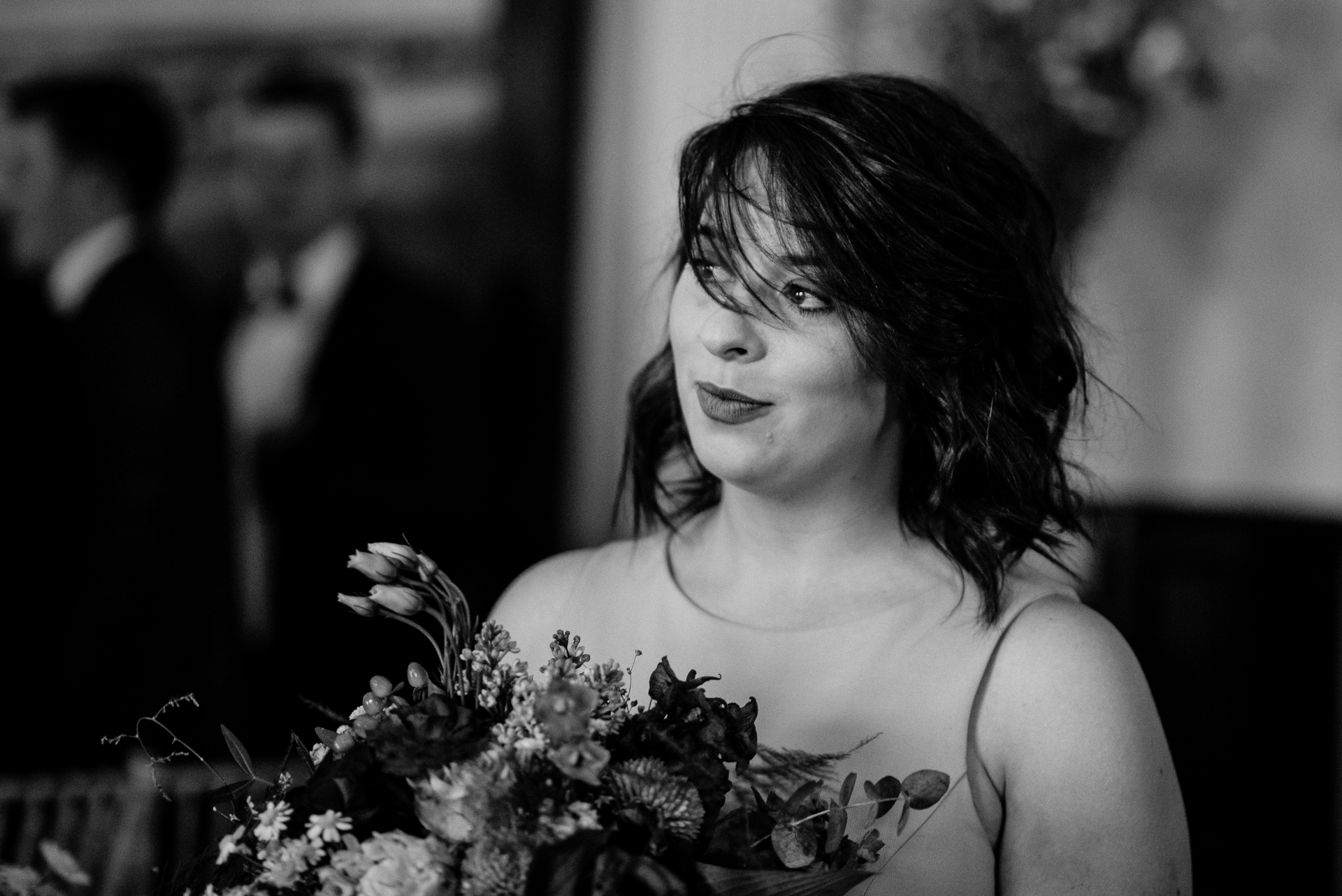 Bride and groom exchanging vows during their wedding ceremony at Glenlo Abbey Hotel, Galway.