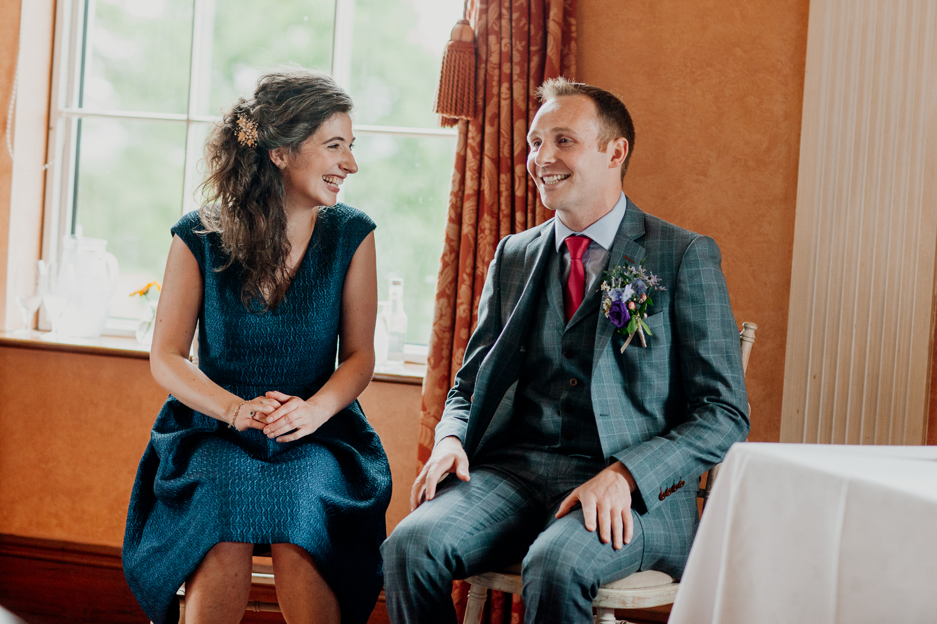 Bride and groom exchanging vows during their wedding ceremony at Glenlo Abbey Hotel, Galway.