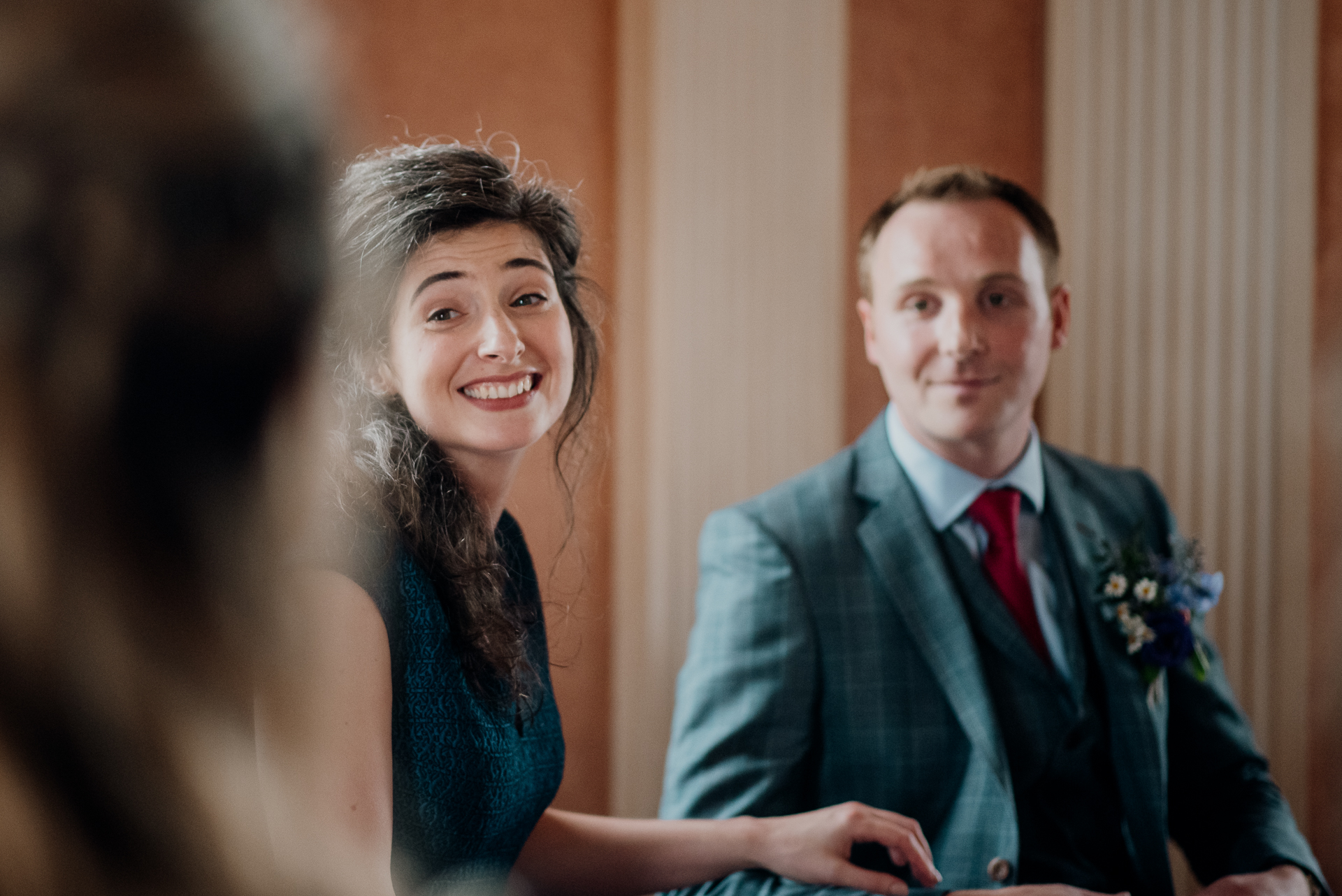 Bride and groom exchanging vows during their wedding ceremony at Glenlo Abbey Hotel, Galway.