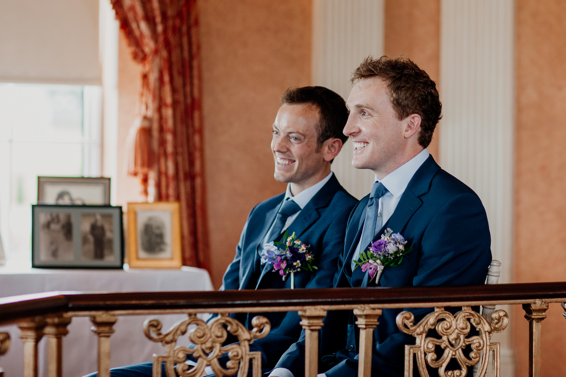 Bride and groom exchanging vows during their wedding ceremony at Glenlo Abbey Hotel, Galway.