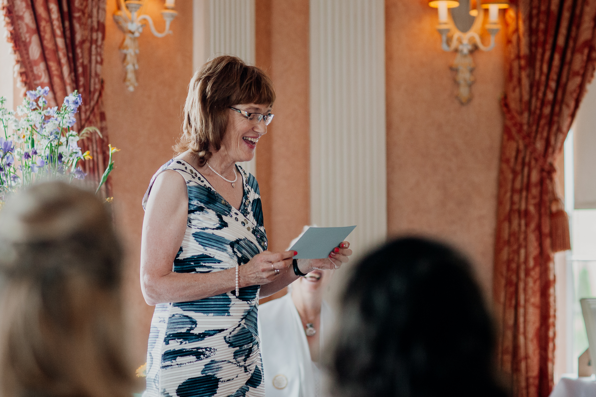 Bride and groom exchanging vows during their wedding ceremony at Glenlo Abbey Hotel, Galway.