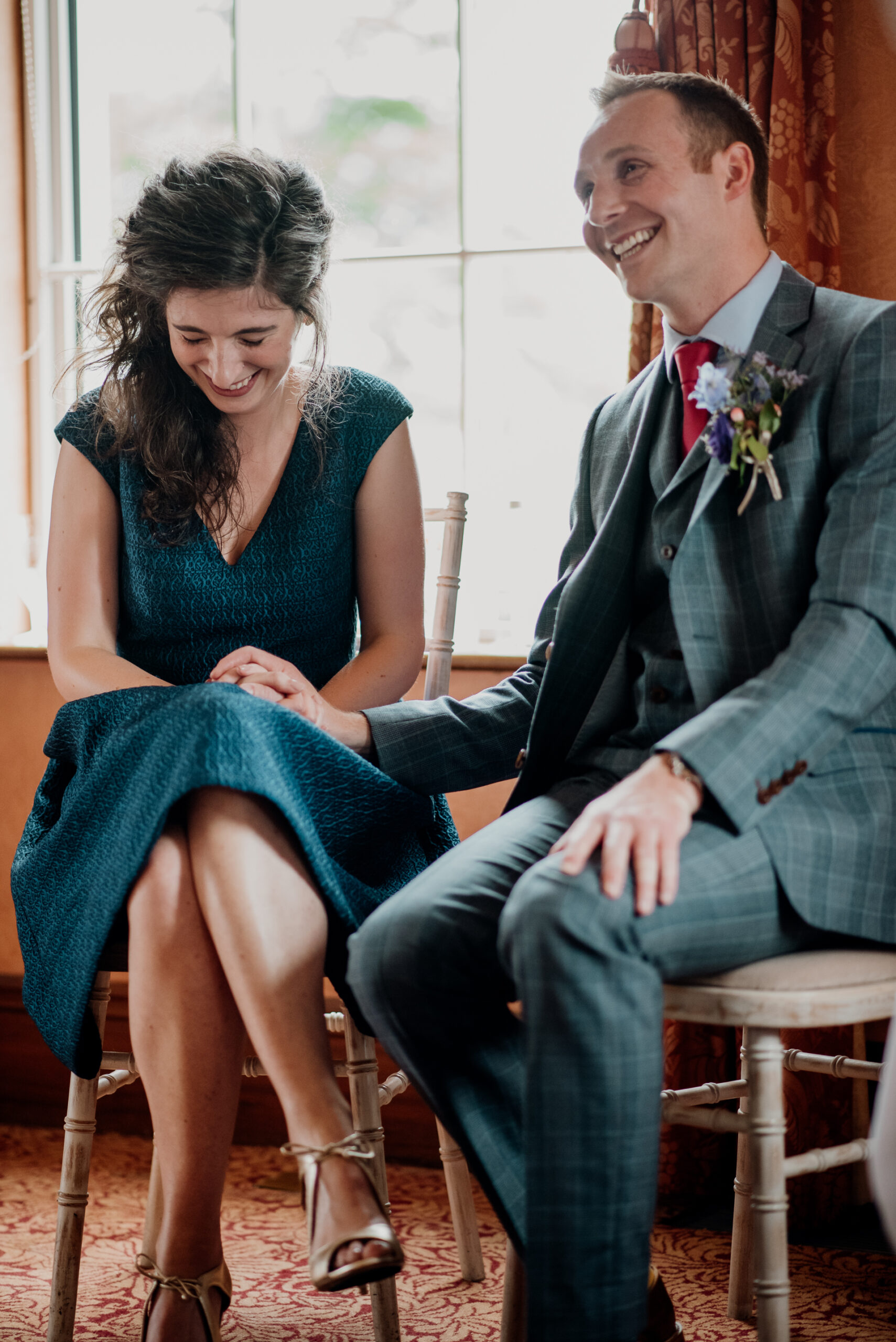 Bride and groom exchanging vows during their wedding ceremony at Glenlo Abbey Hotel, Galway.