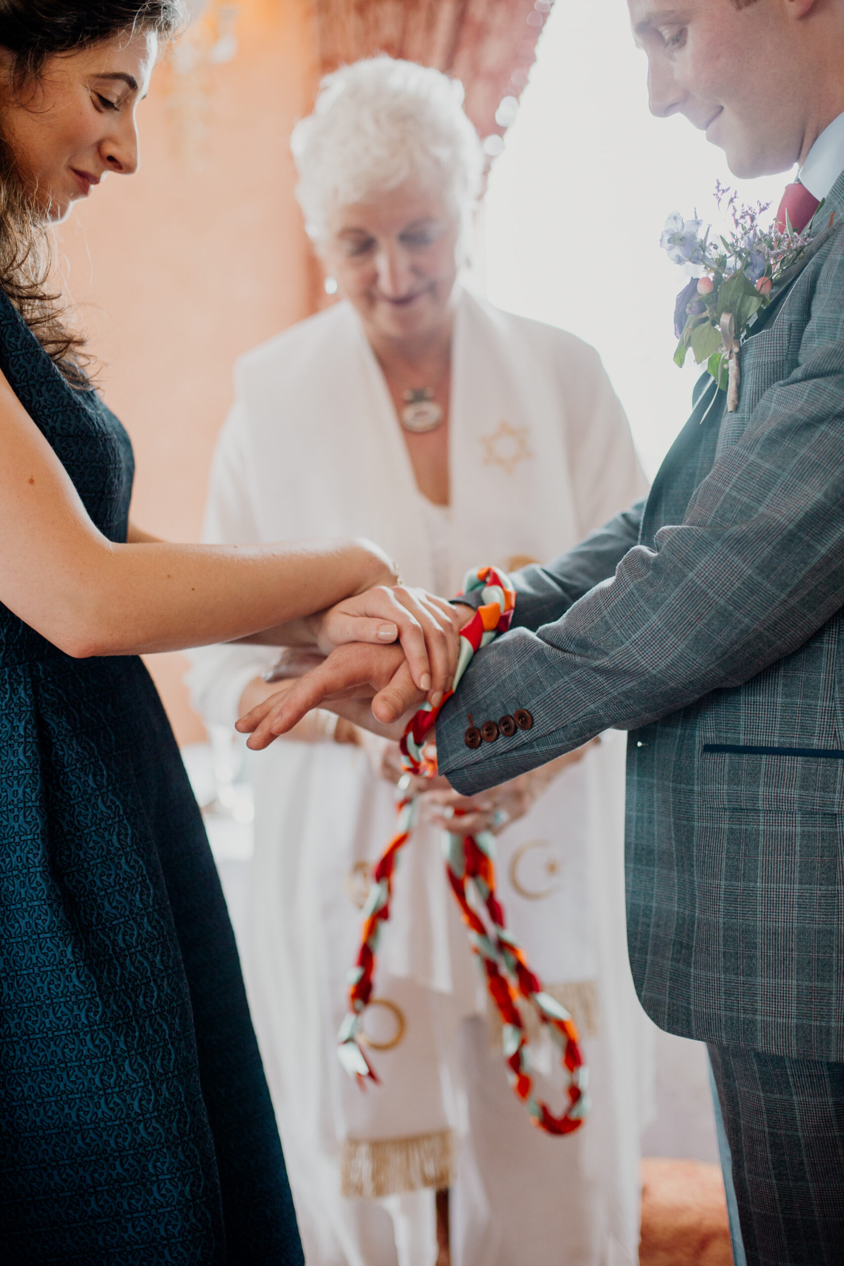 Bride and groom exchanging vows during their wedding ceremony at Glenlo Abbey Hotel, Galway.