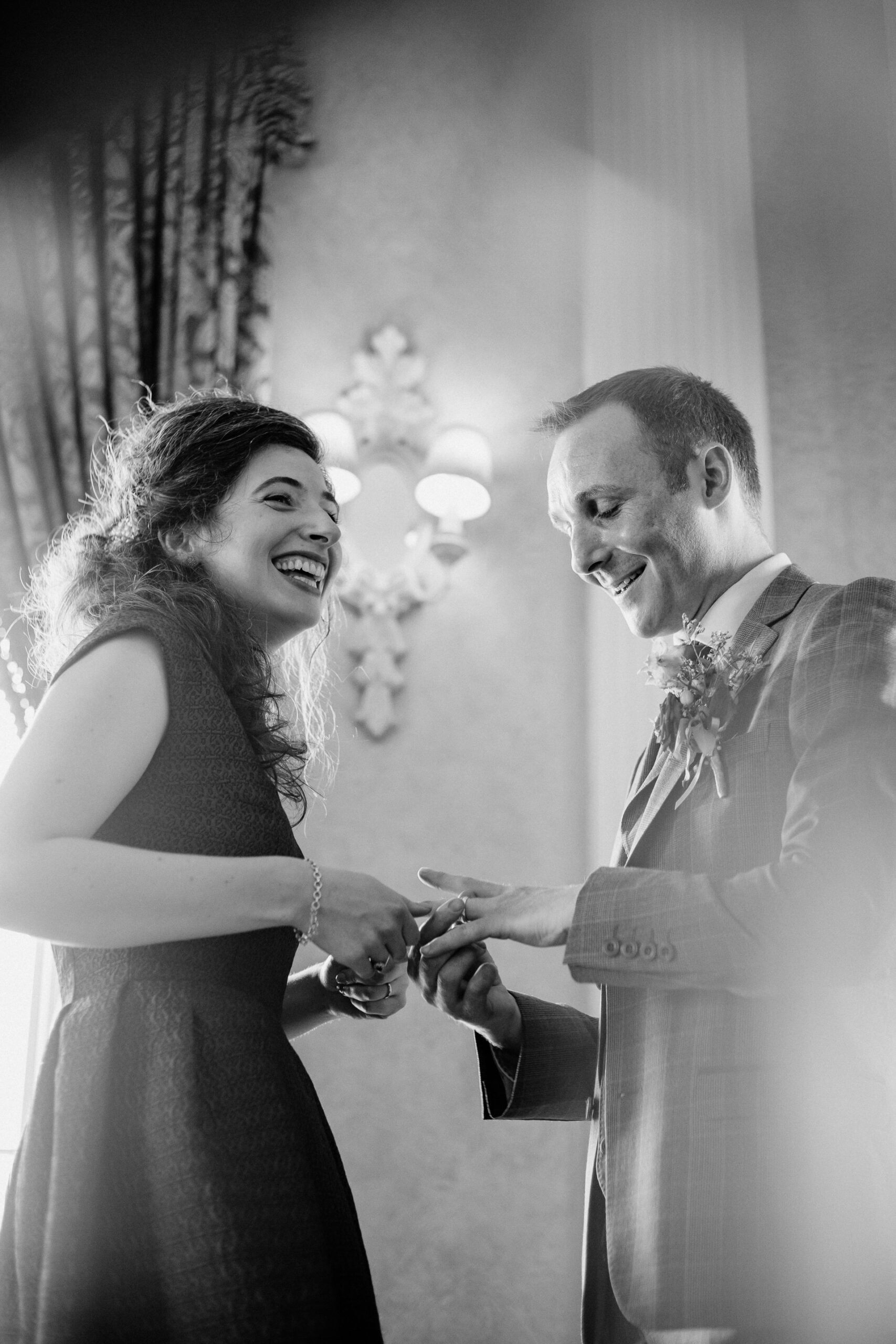 Bride and groom exchanging vows during their wedding ceremony at Glenlo Abbey Hotel, Galway.