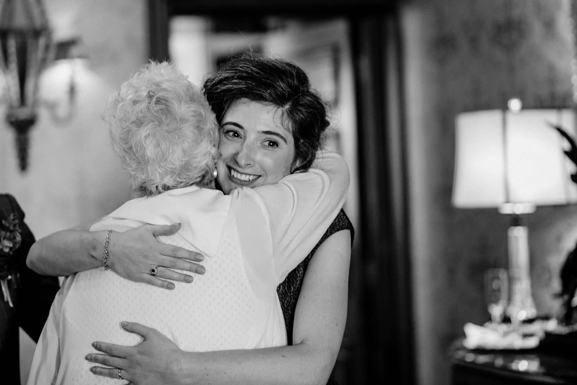 Bride and groom exchanging vows during their wedding ceremony at Glenlo Abbey Hotel, Galway.