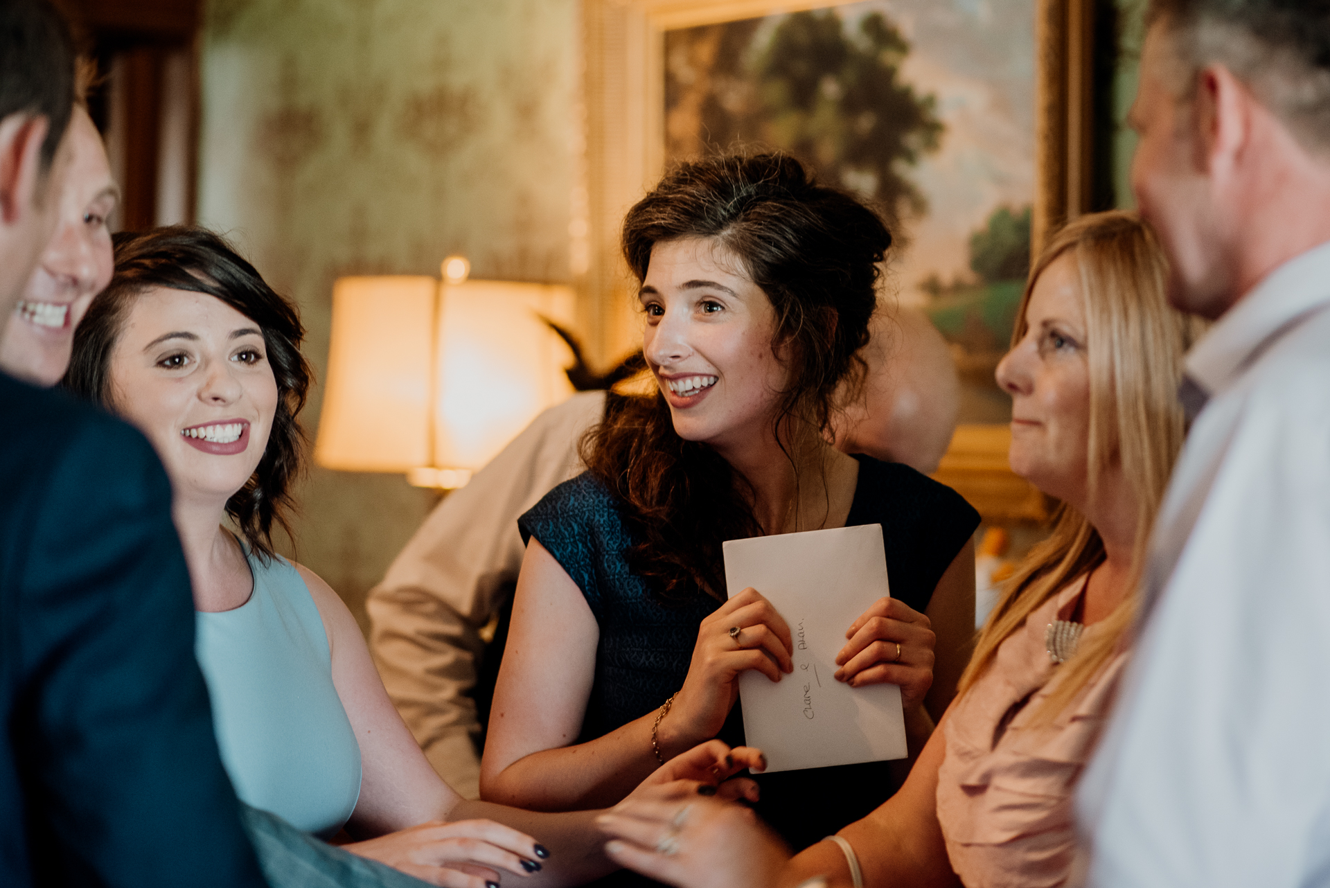 Bride and groom exchanging vows during their wedding ceremony at Glenlo Abbey Hotel, Galway.