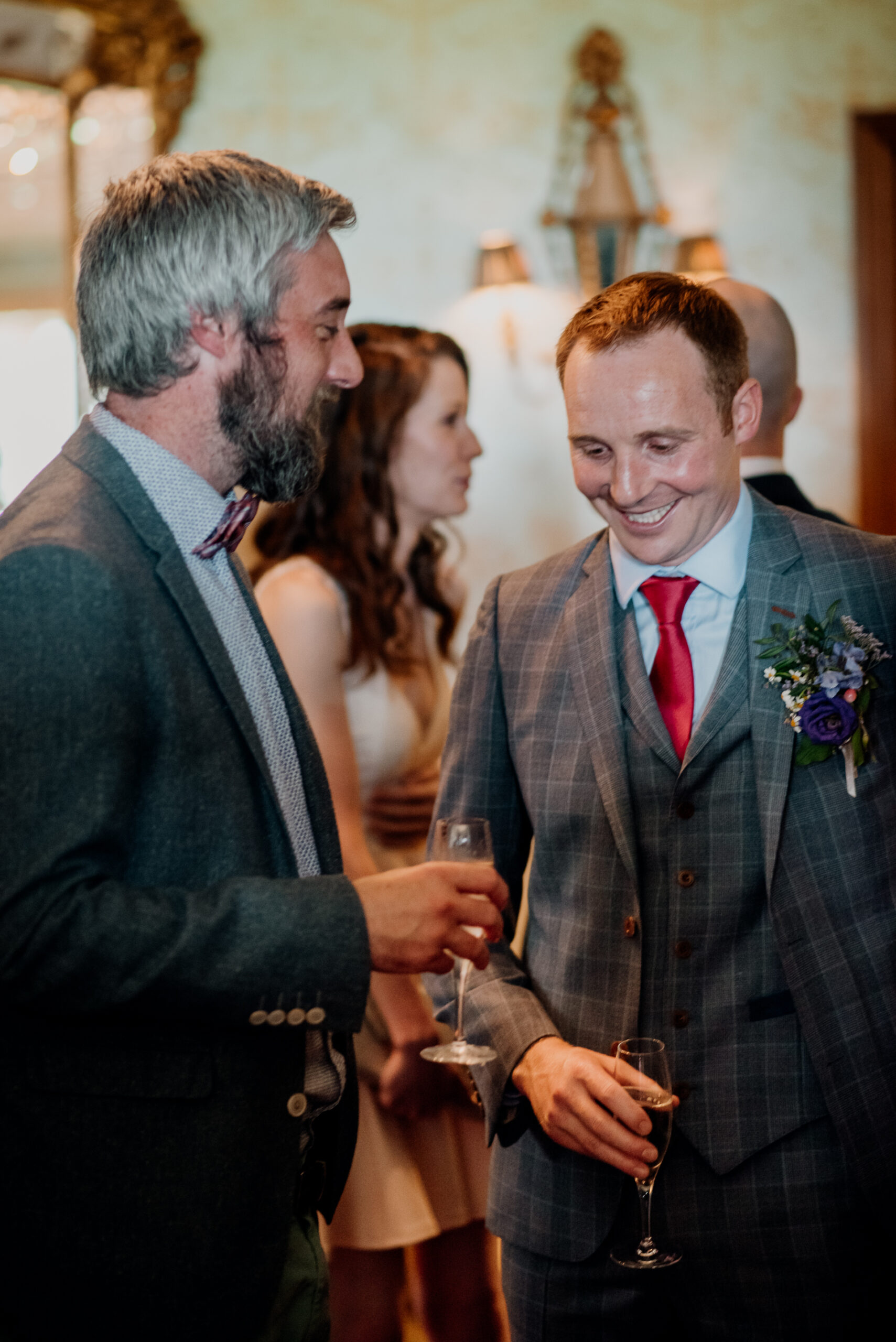 Bride and groom exchanging vows during their wedding ceremony at Glenlo Abbey Hotel, Galway.