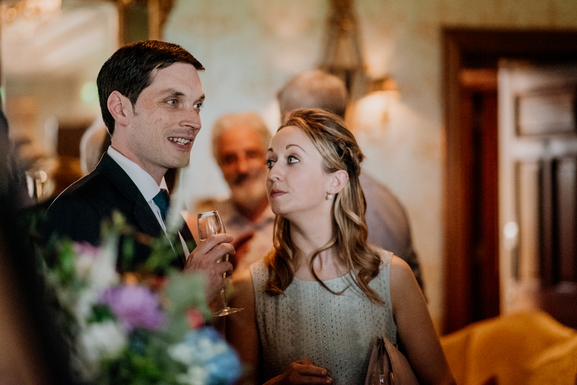 Bride and groom exchanging vows during their wedding ceremony at Glenlo Abbey Hotel, Galway.