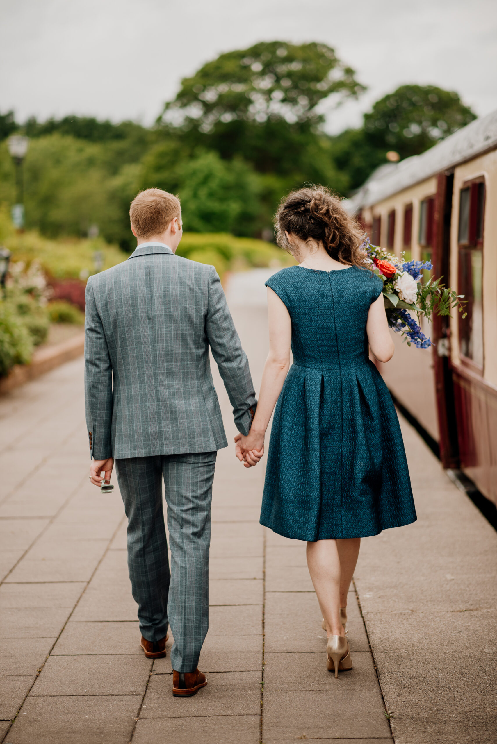 Bride and groom sharing an intimate moment during their outdoor wedding photoshoot at Glenlo Abbey Hotel, Galway.