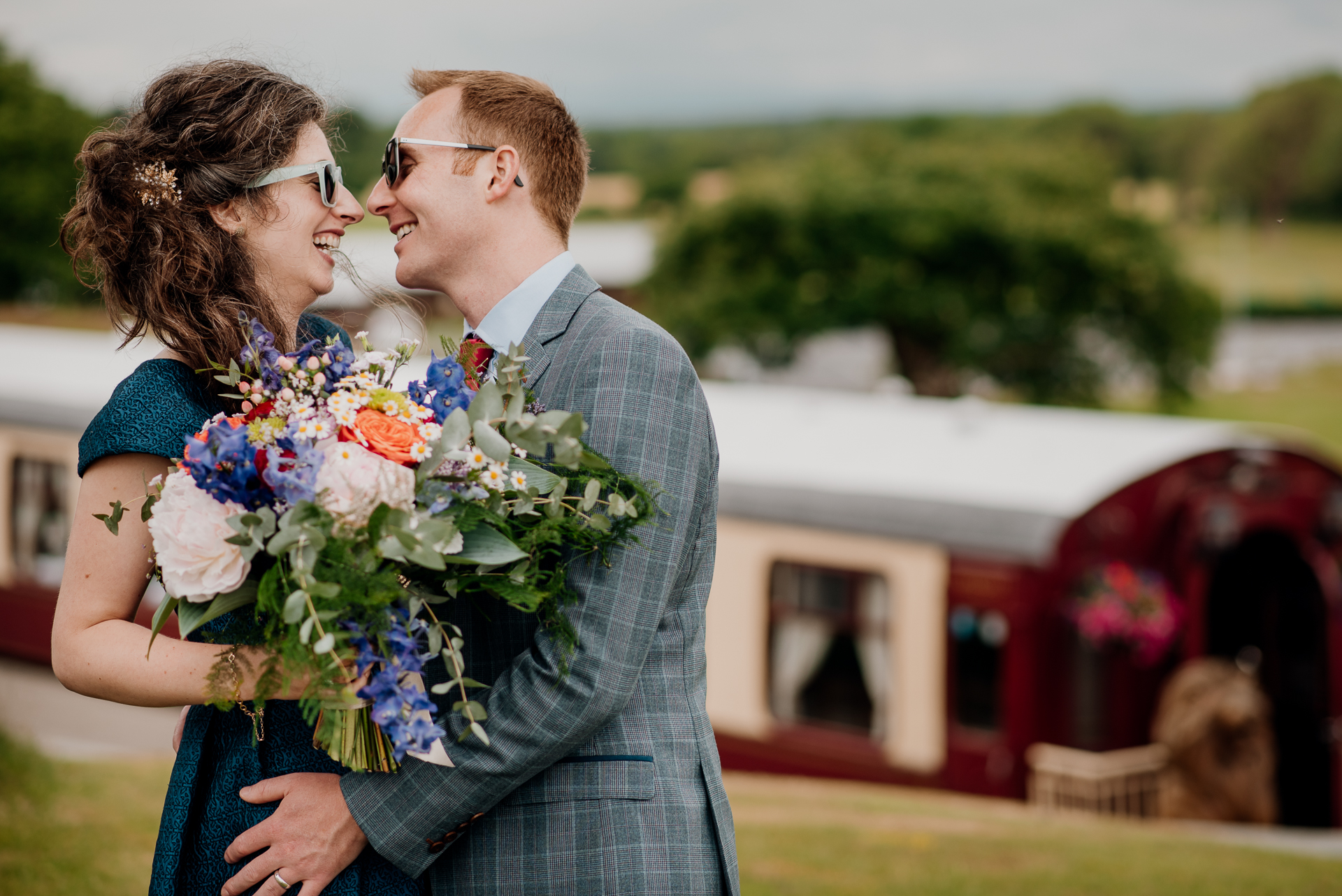 Bride and groom sharing an intimate moment during their outdoor wedding photoshoot at Glenlo Abbey Hotel, Galway.