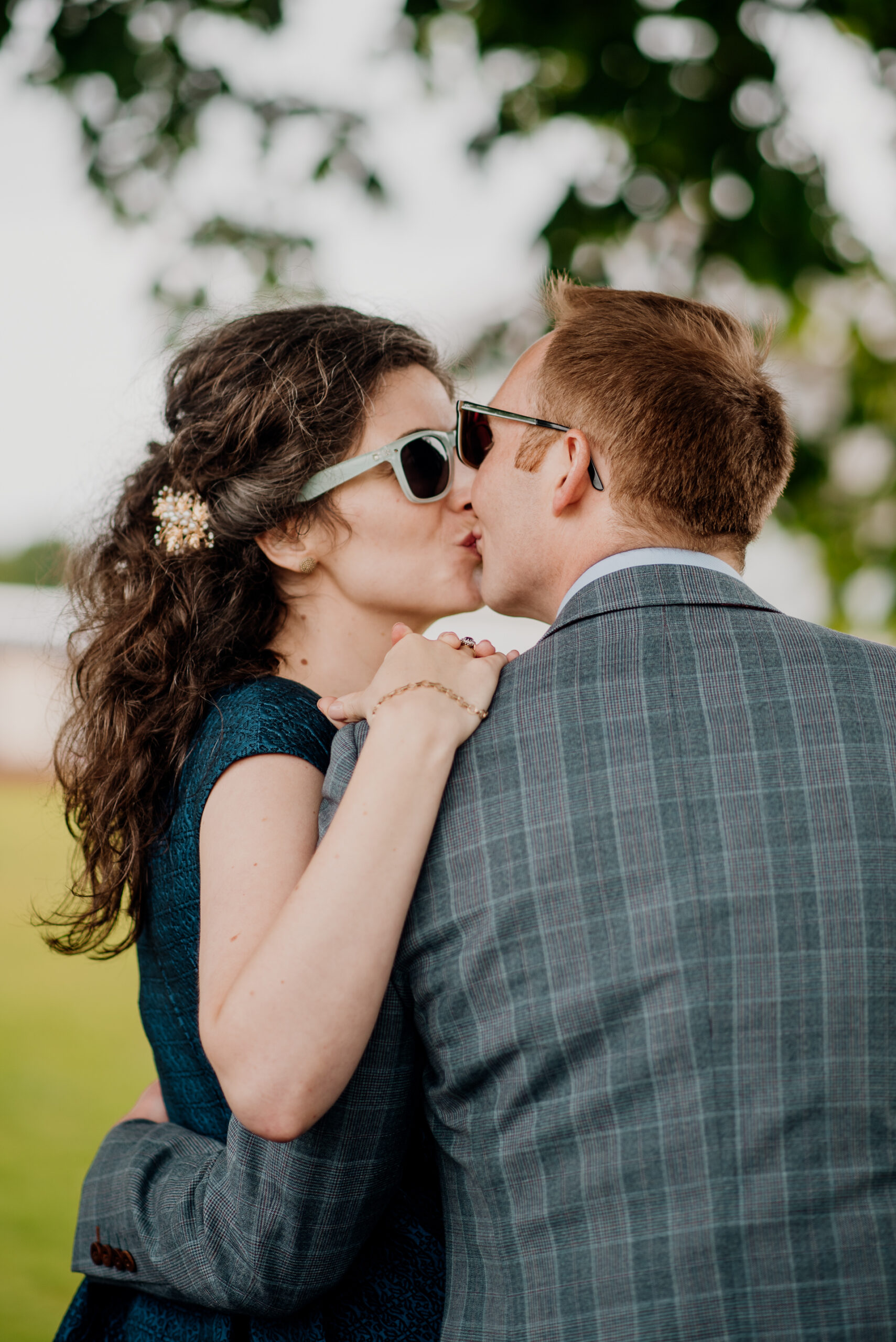 Bride and groom sharing an intimate moment during their outdoor wedding photoshoot at Glenlo Abbey Hotel, Galway.