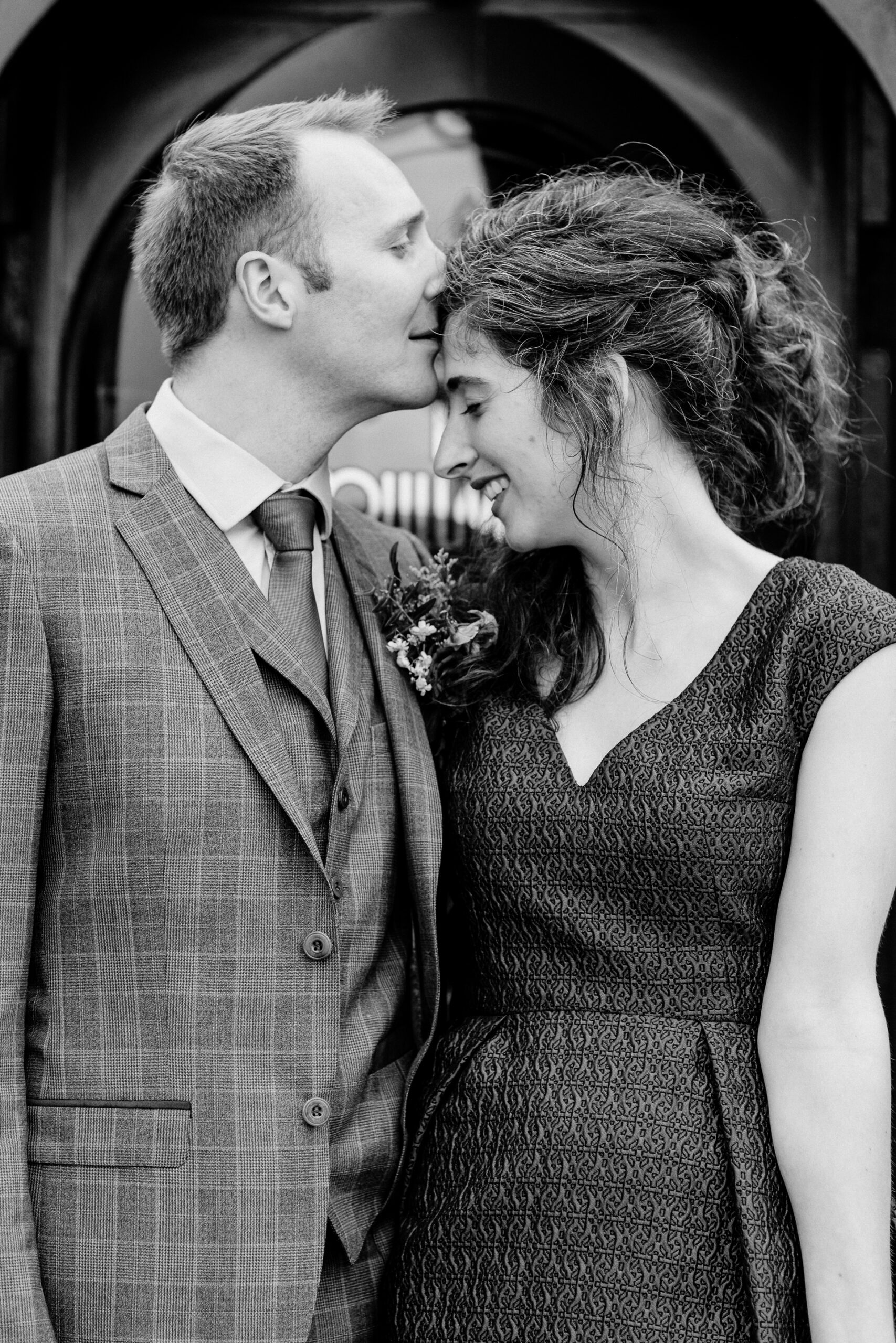 Bride and groom sharing an intimate moment during their outdoor wedding photoshoot at Glenlo Abbey Hotel, Galway.