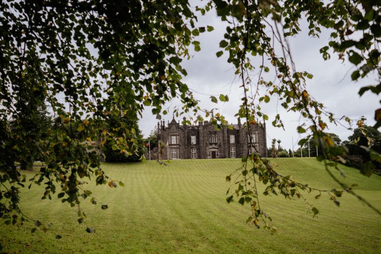 Belleek Castle wedding venue in Ireland at golden hour, showcasing its historic charm.