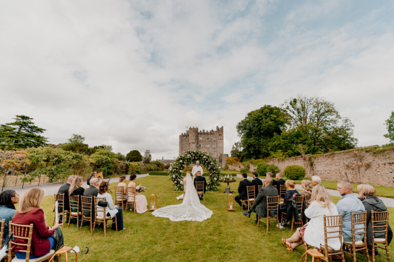 An elegant outdoor wedding ceremony at Kilkea Castle, capturing the romance and historic charm of this iconic Irish venue.