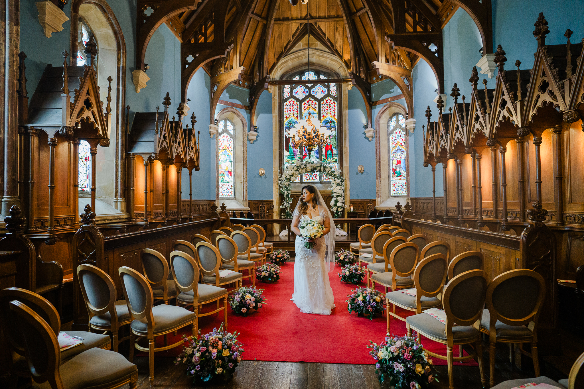 Bride and groom standing in the chapel at Markree Castle during their wedding ceremony in Sligo, Ireland