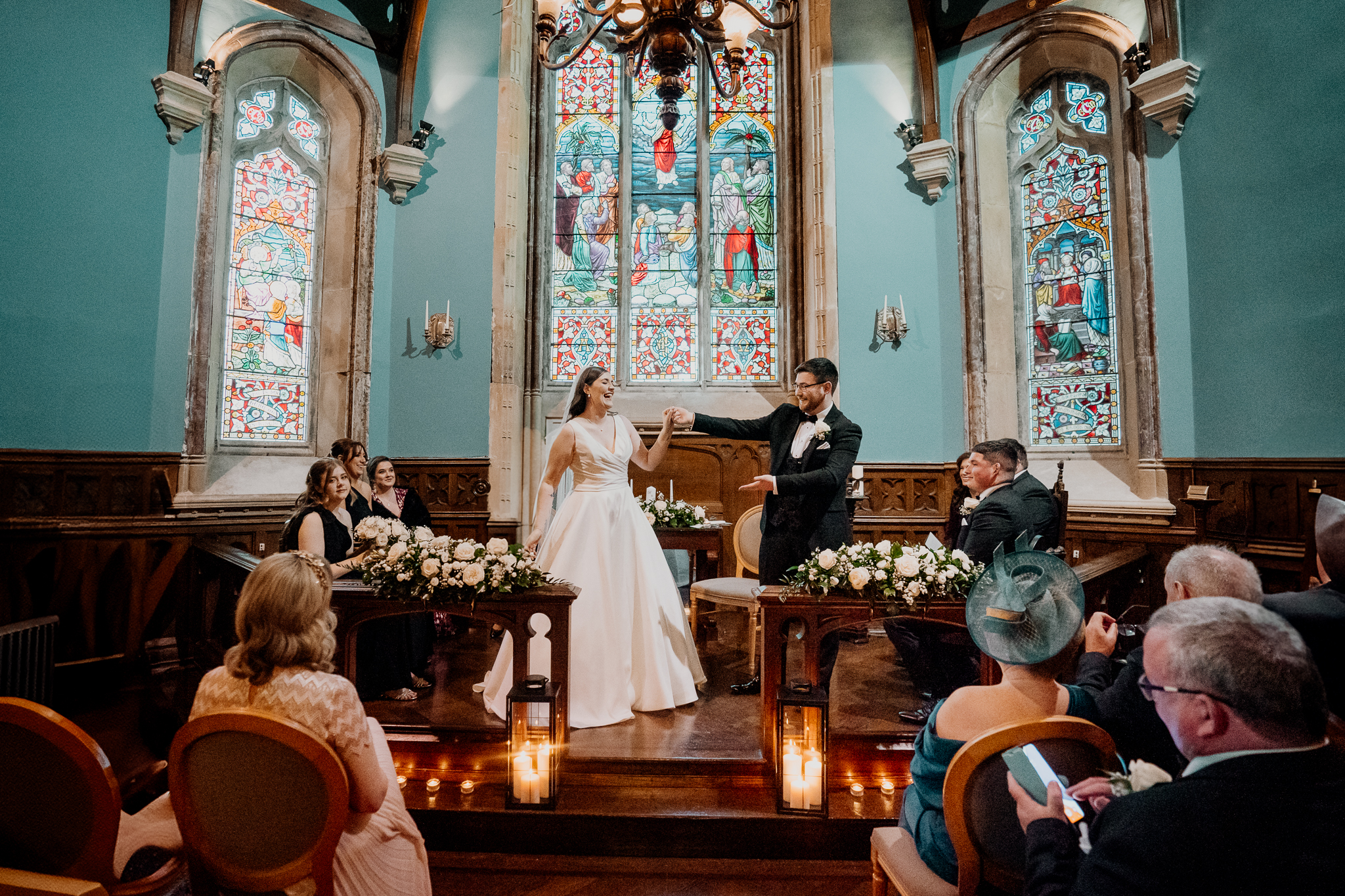 Bride and groom exchanging vows in the chapel at Markree Castle during their elegant wedding ceremony in Sligo, Ireland