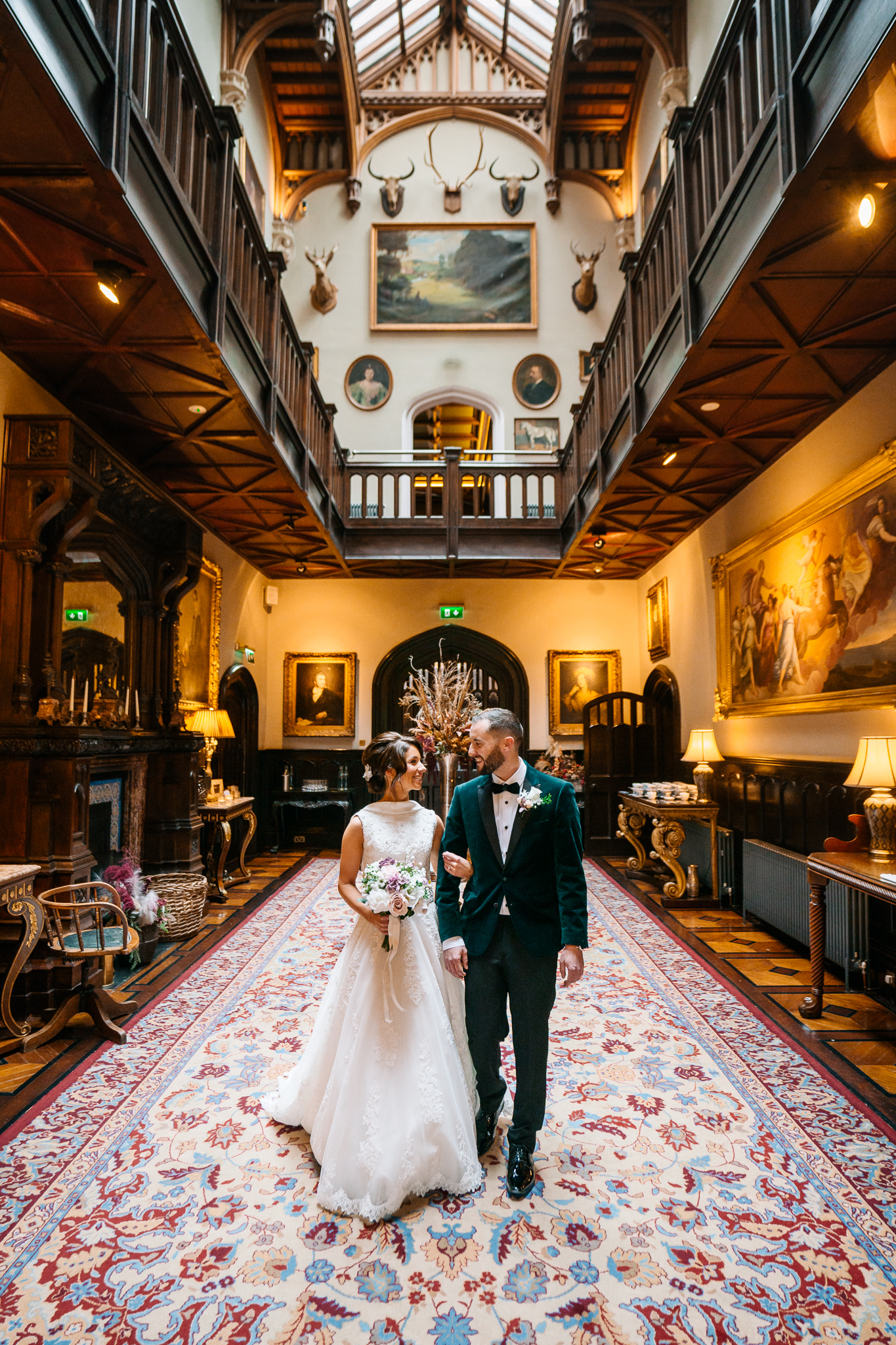 Bride and groom entering the grand hall of Markree Castle during their wedding day, captured in a candid moment by a Dublin wedding photographer