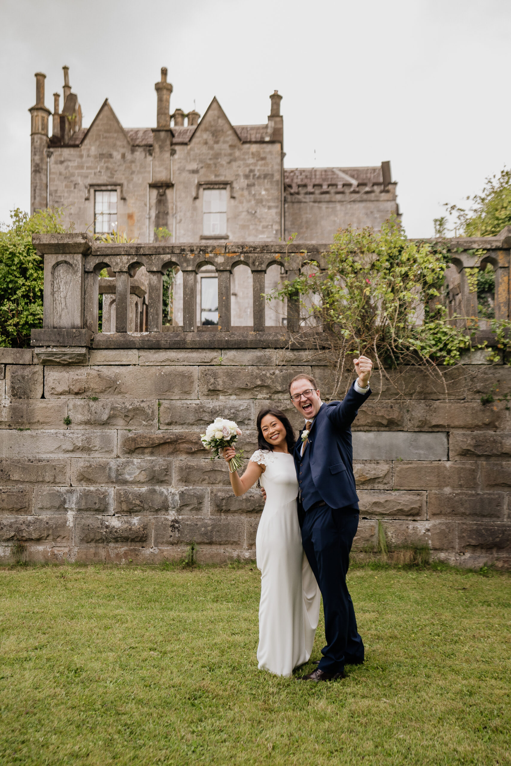bride and groom smiling after first look in courtyard at belleek castle