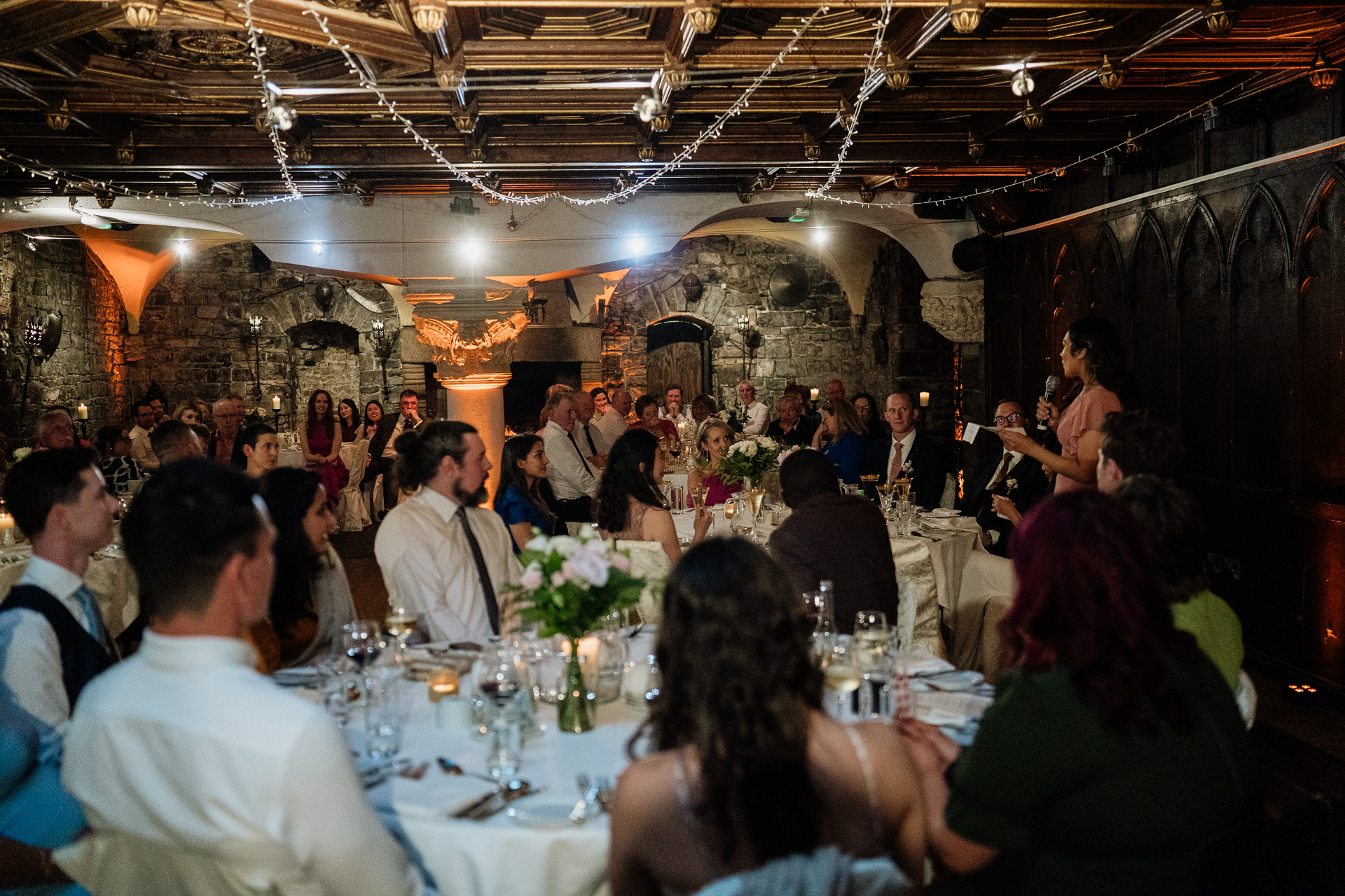 Wedding guests enjoying dinner and speeches at Belleek Castle