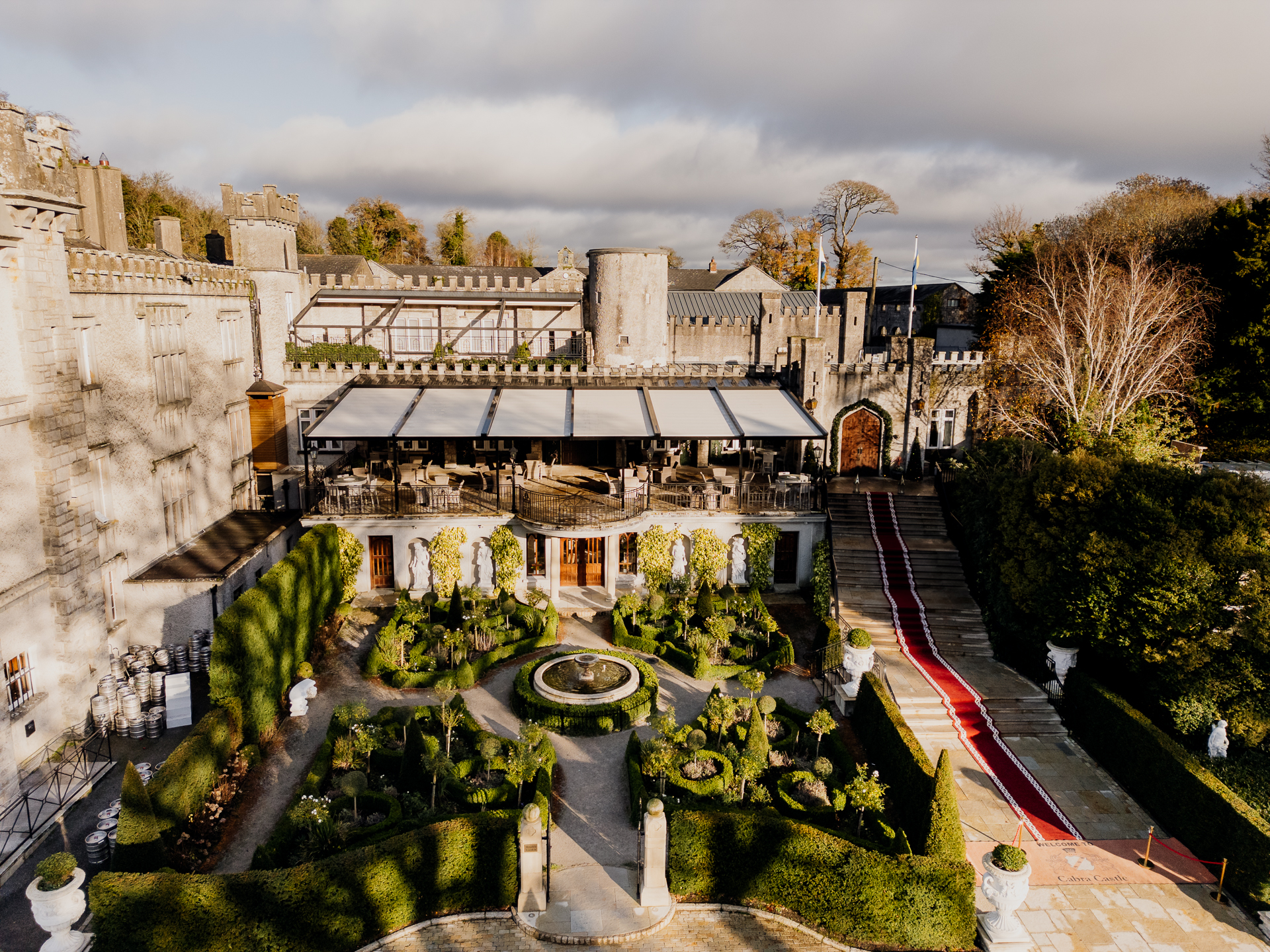 Aerial view of Cabra Castle courtyard and formal gardens on a sunny day