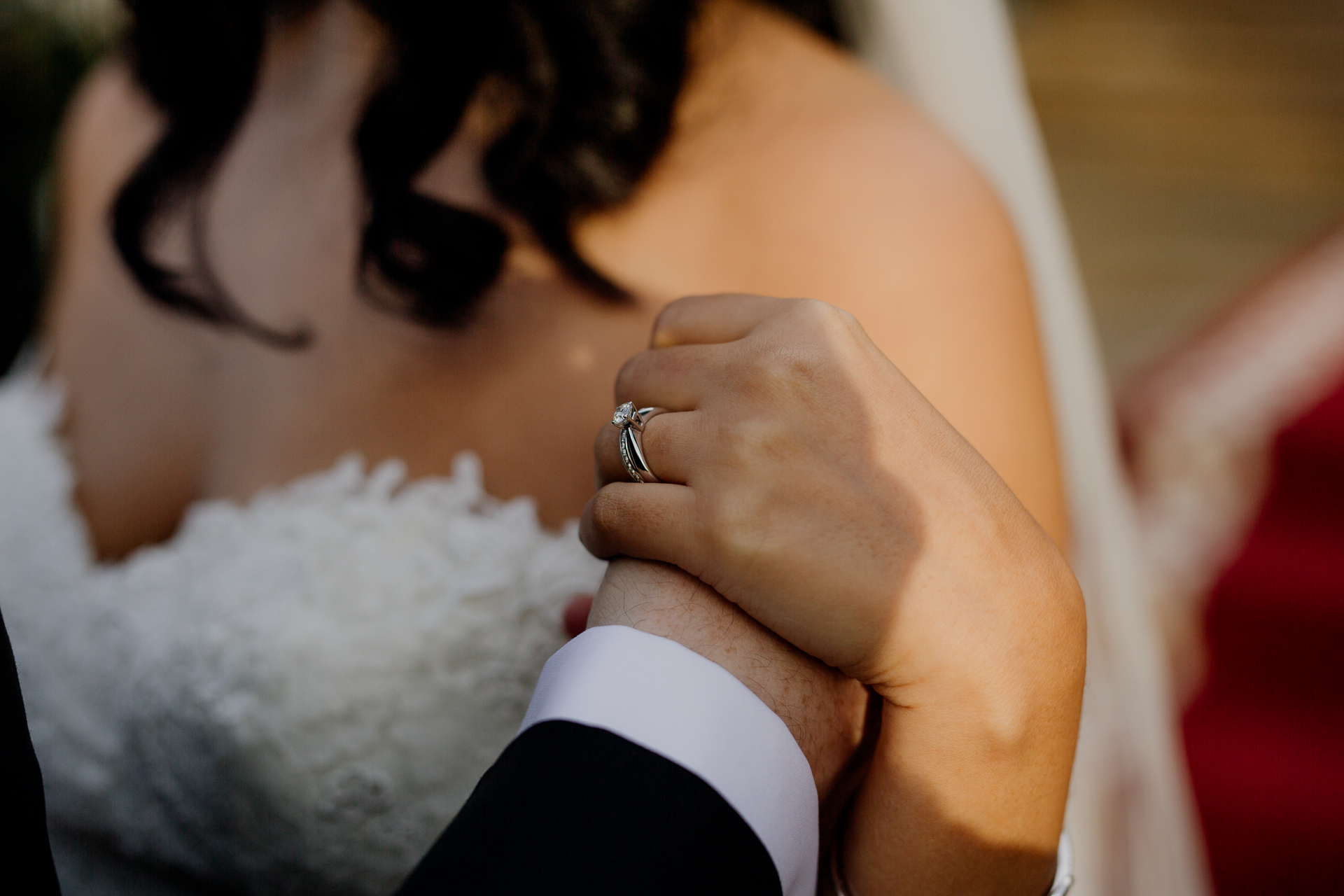 Emotional detail of bride’s hand gently touching groom’s face during First Look at Cabra Castle Wedding