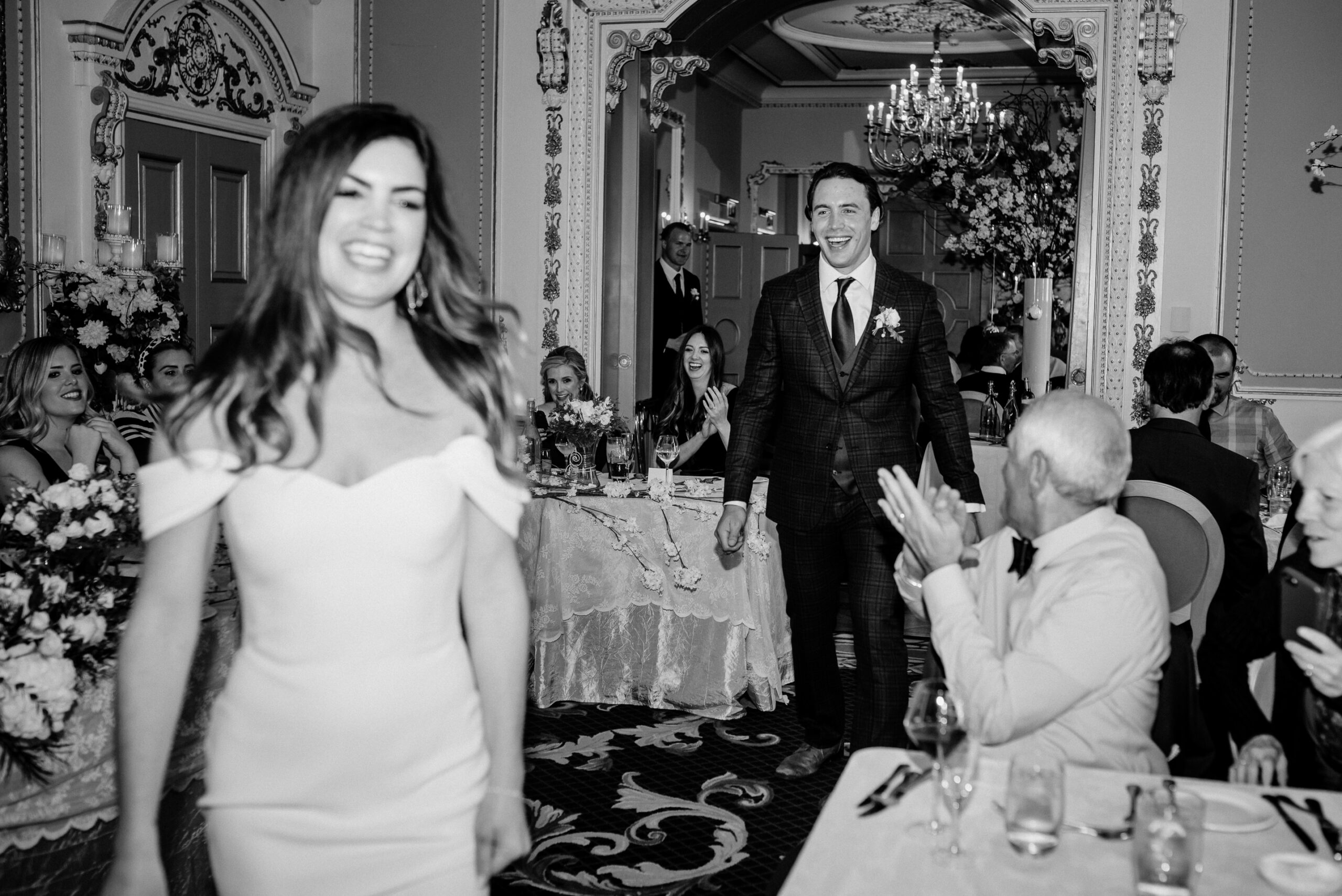 Bride and groom making a joyful entrance to their castle wedding reception at Markree Castle in Ireland – destination celebration with American guests