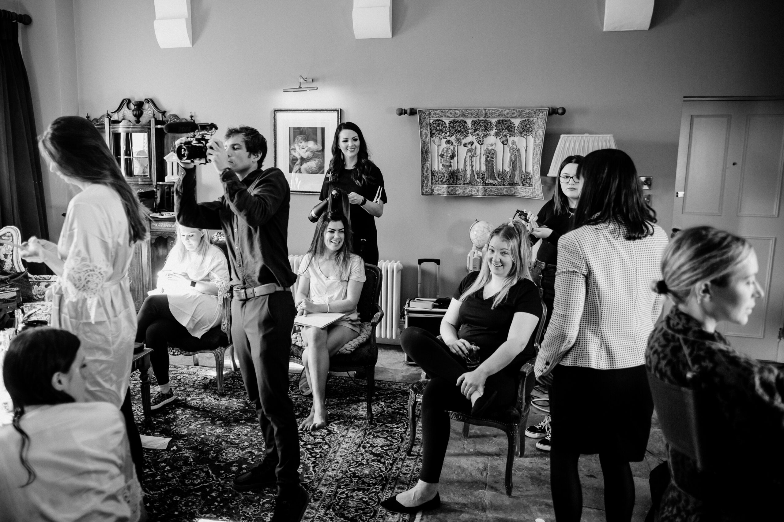 Bridesmaids helping the bride get ready during a destination wedding morning at Markree Castle in Ireland