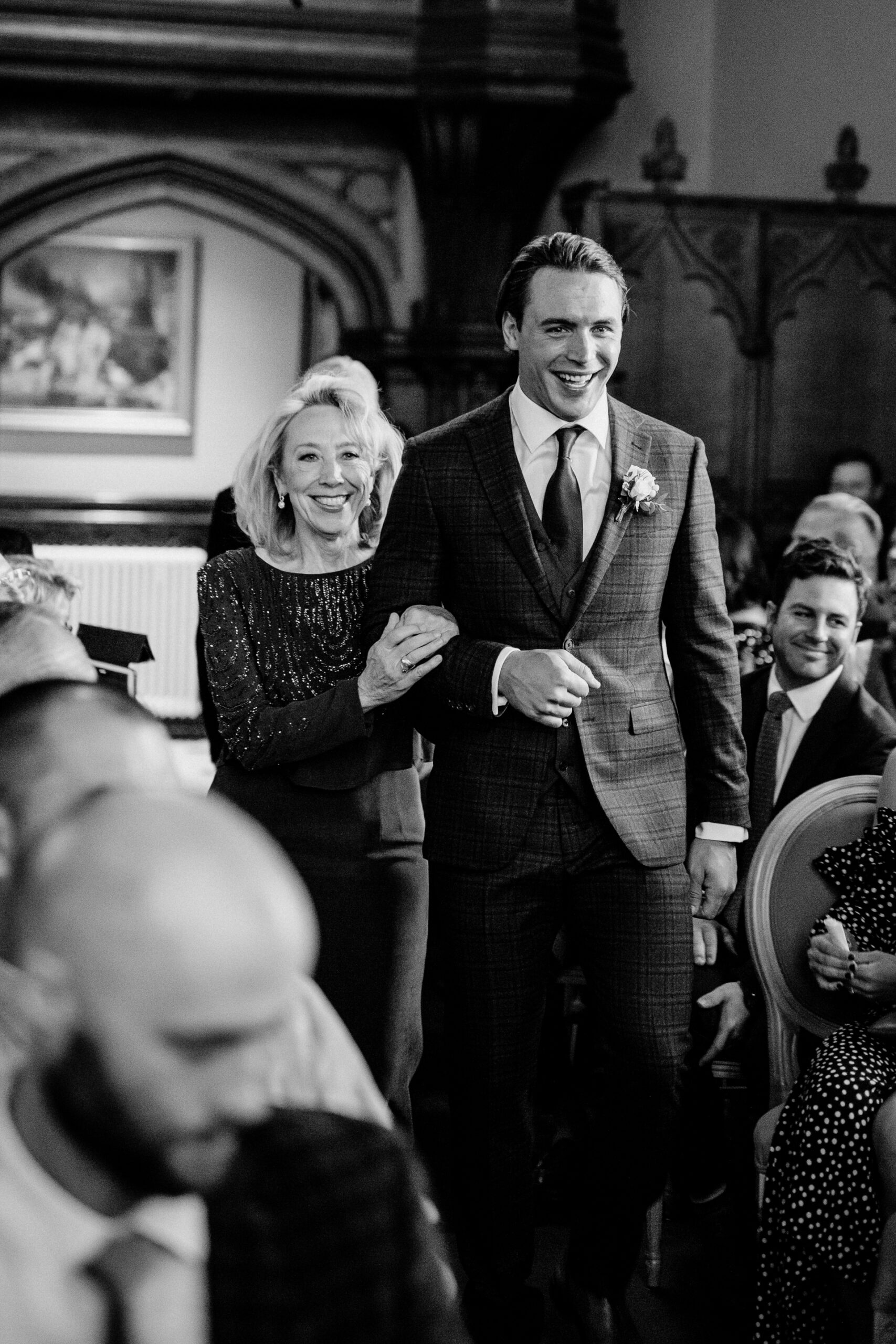 Groom walking down the aisle at Markree Castle wedding ceremony with his mother – emotional start of a destination wedding in Ireland