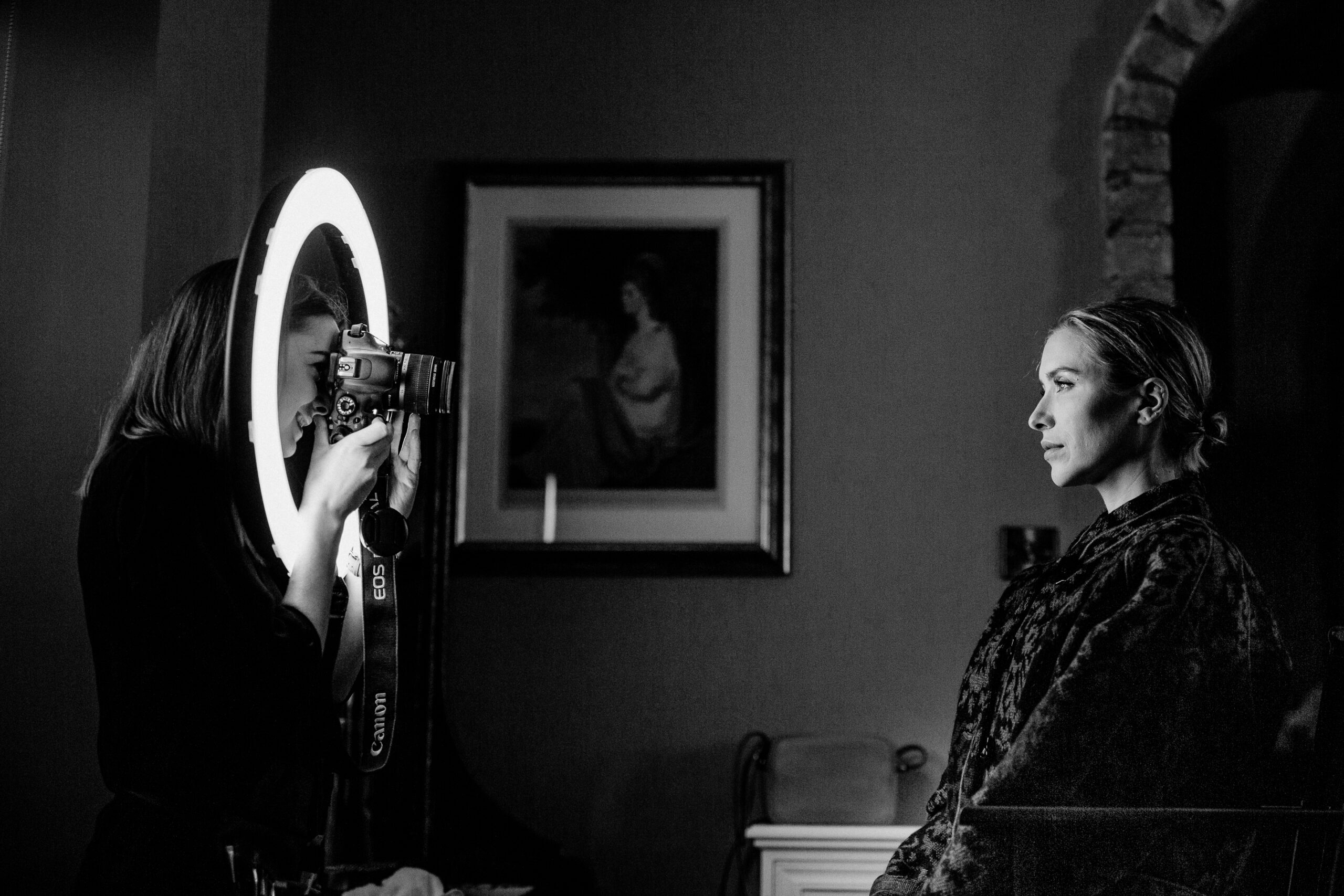 Bride having her makeup done in a softly lit room at Markree Castle – wedding preparations in Ireland