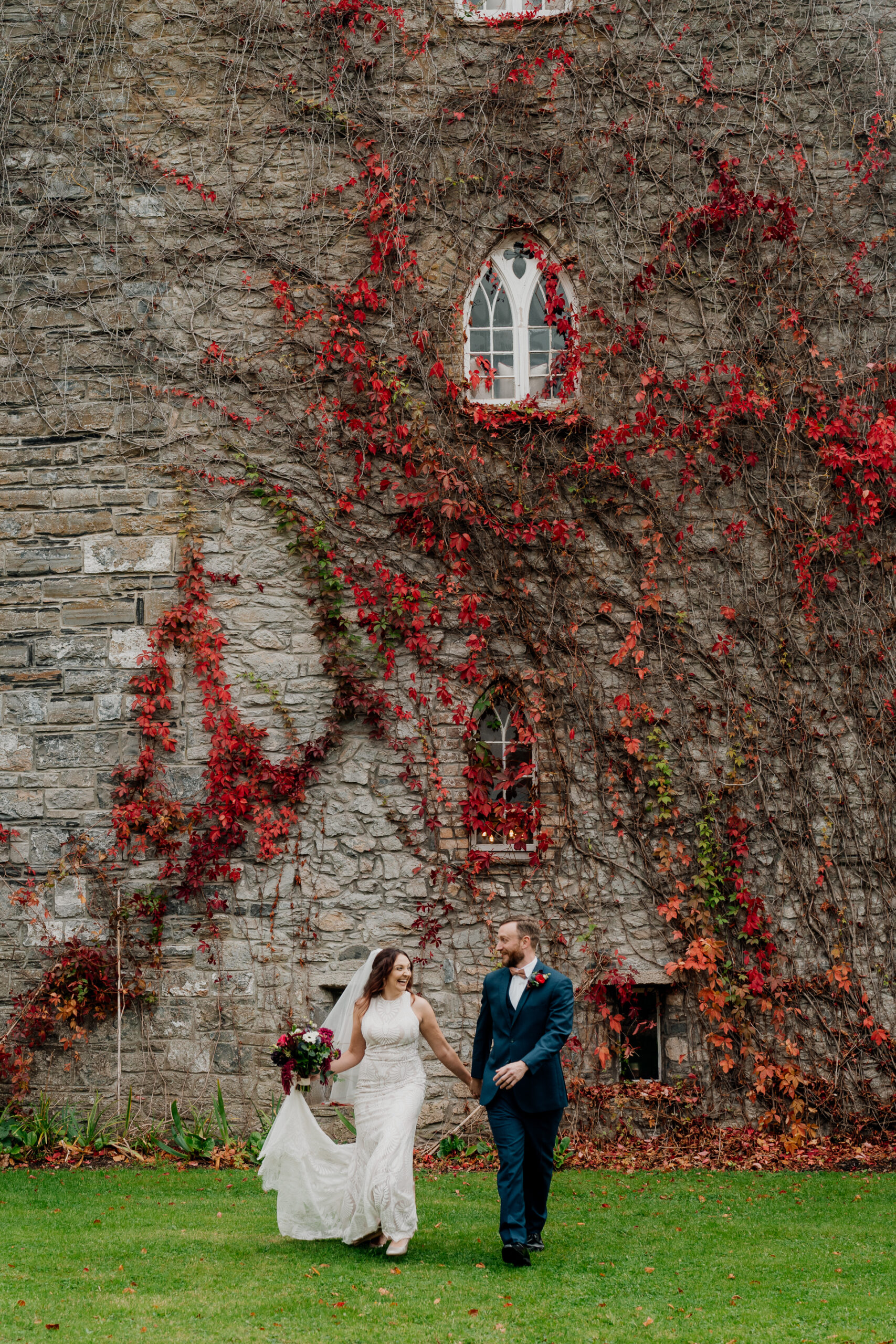 Wedding couple posing naturally in a green garden under willow trees near Dublin