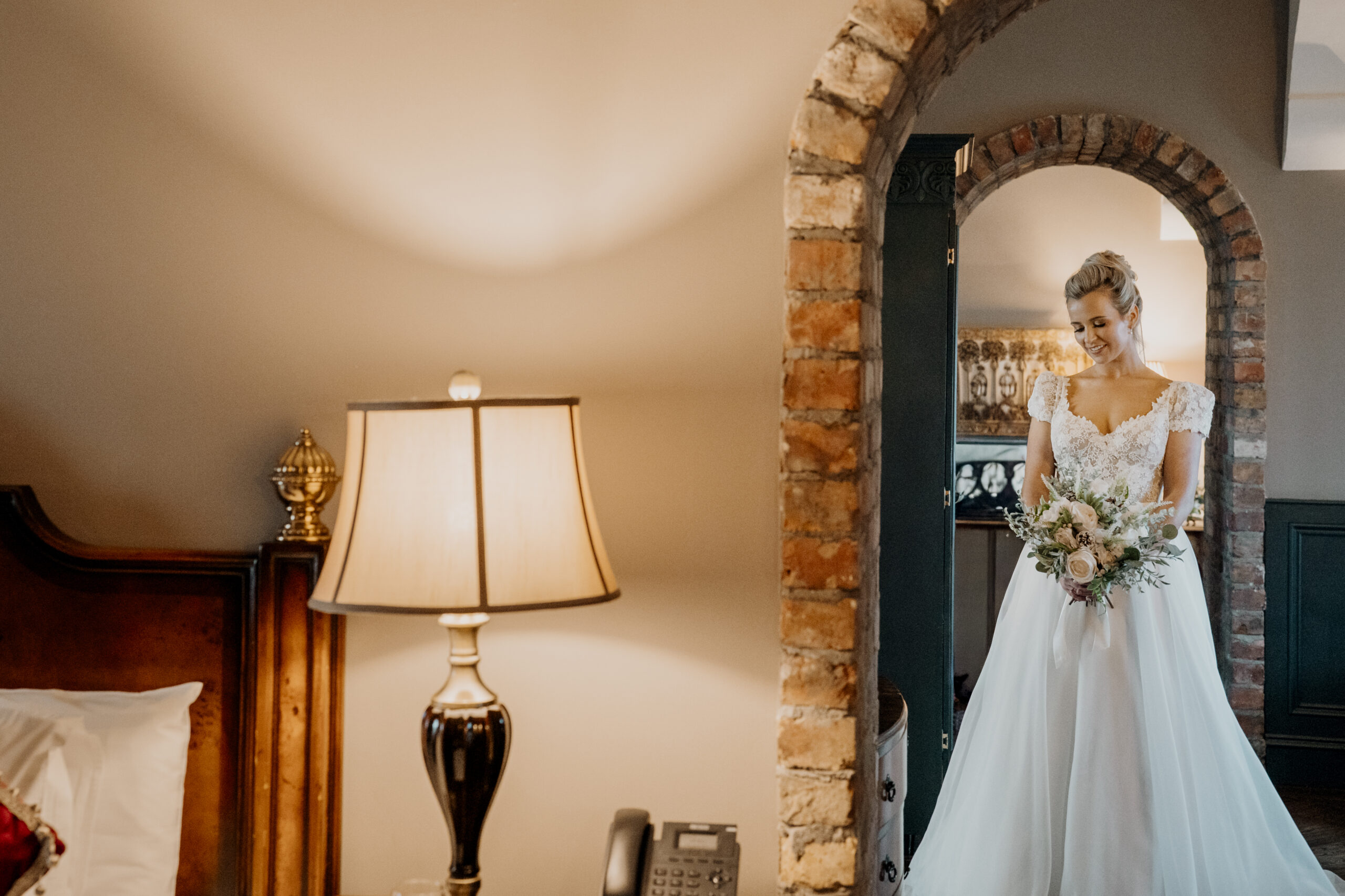 Bride holding her bouquet in the Bridal Suite at Markree Castle