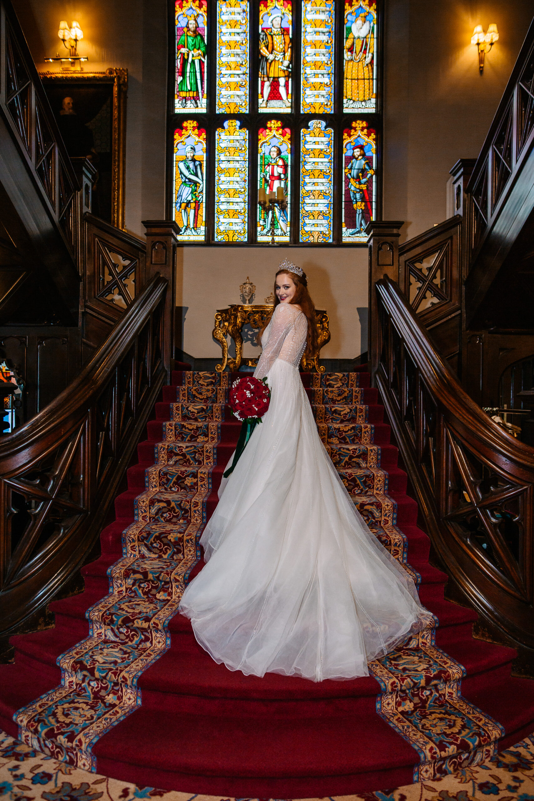 Bride walking down the grand staircase at Markree Castle in a timeless wedding portrait