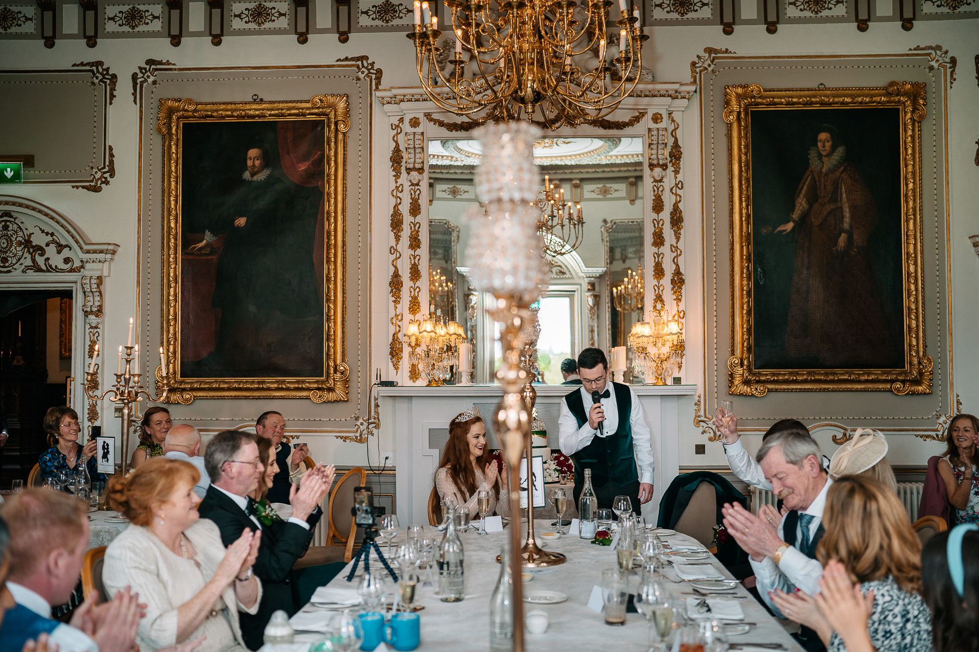 Wedding reception moment at Markree Castle dining room with the couple and guests laughing.
